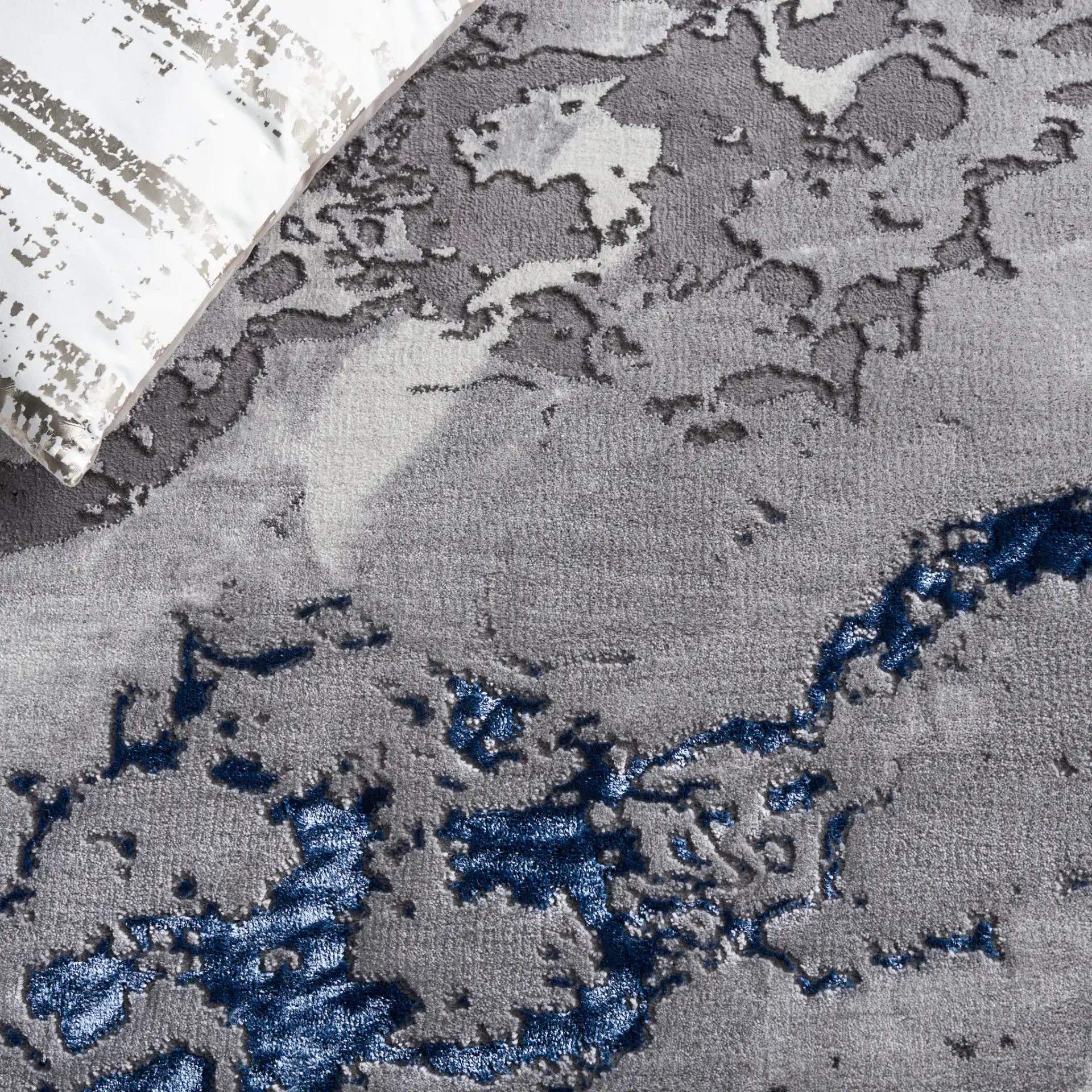 Craft Abstract Marble Rug in Gray / Blue in a styled room