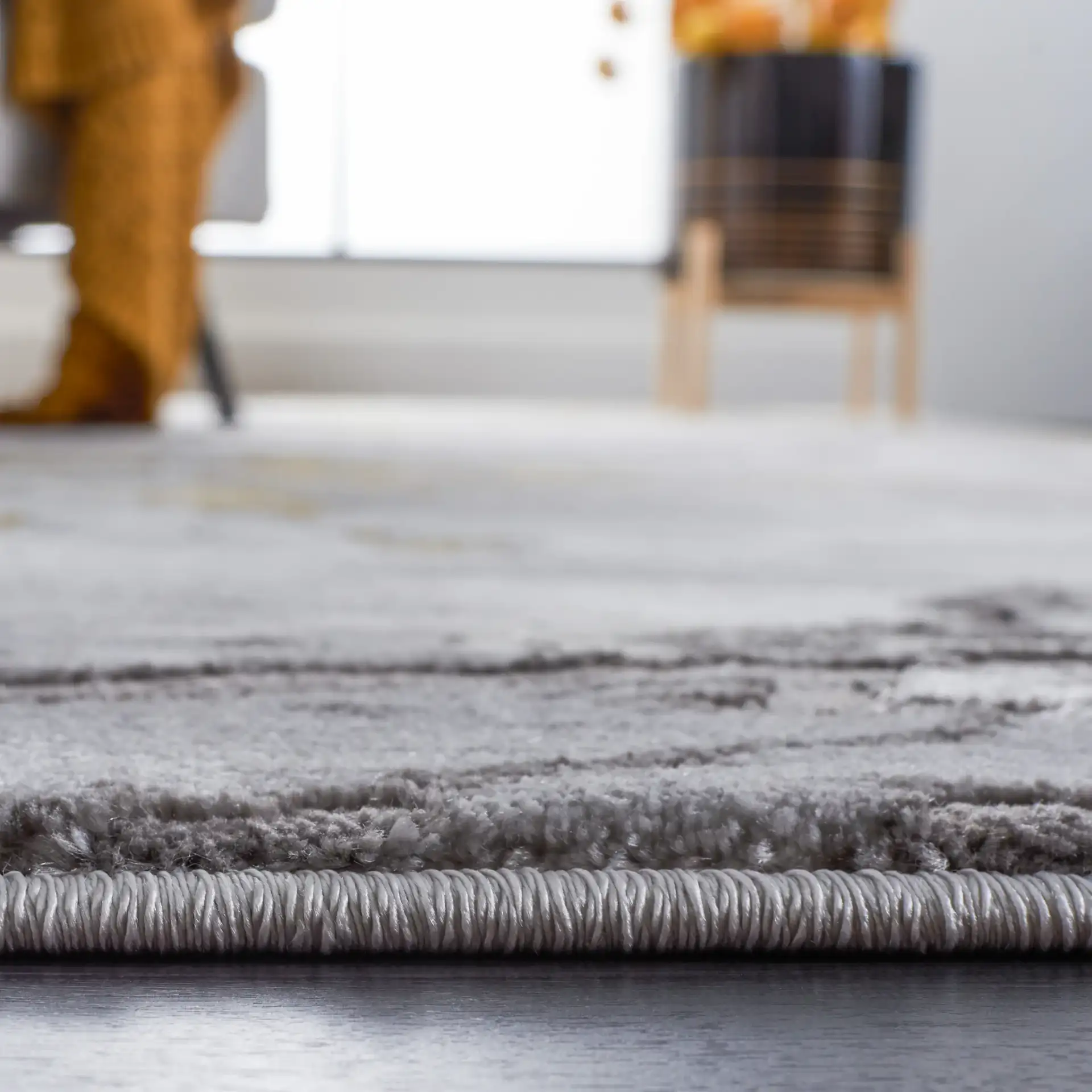 Craft Agate Marble Rug in Gray / Gold in a styled room