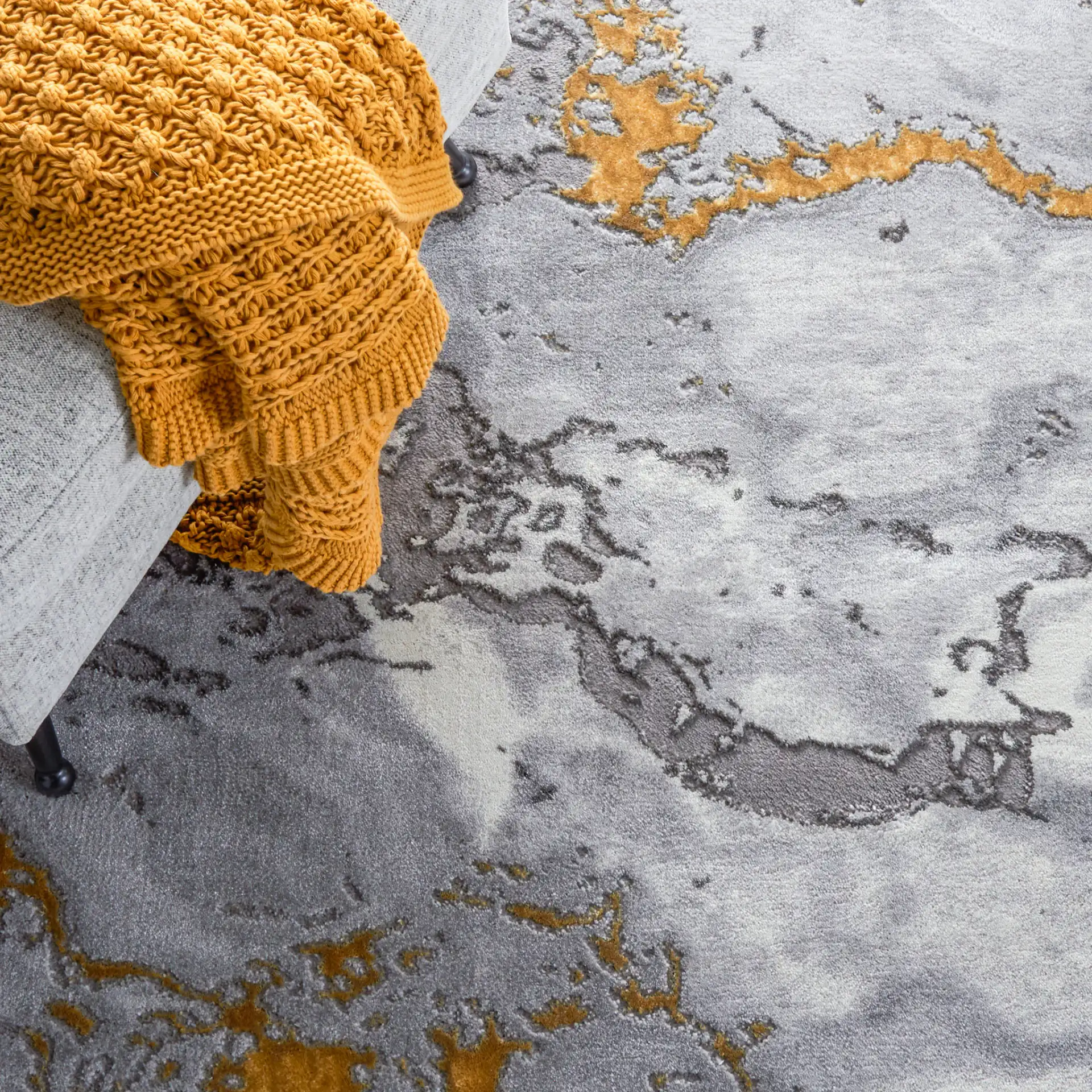 Craft Agate Marble Rug in Gray / Gold in a styled room