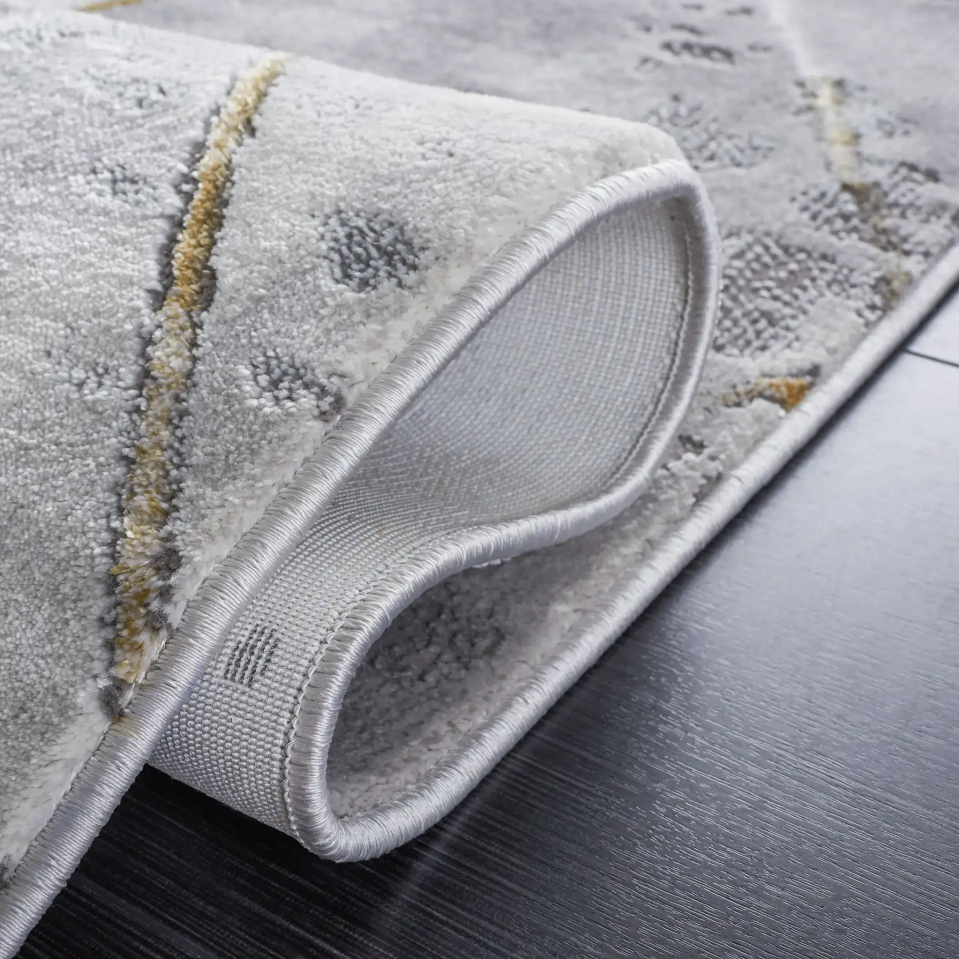 Craft Diamond Grid Rug in Gray / Gold in a styled room
