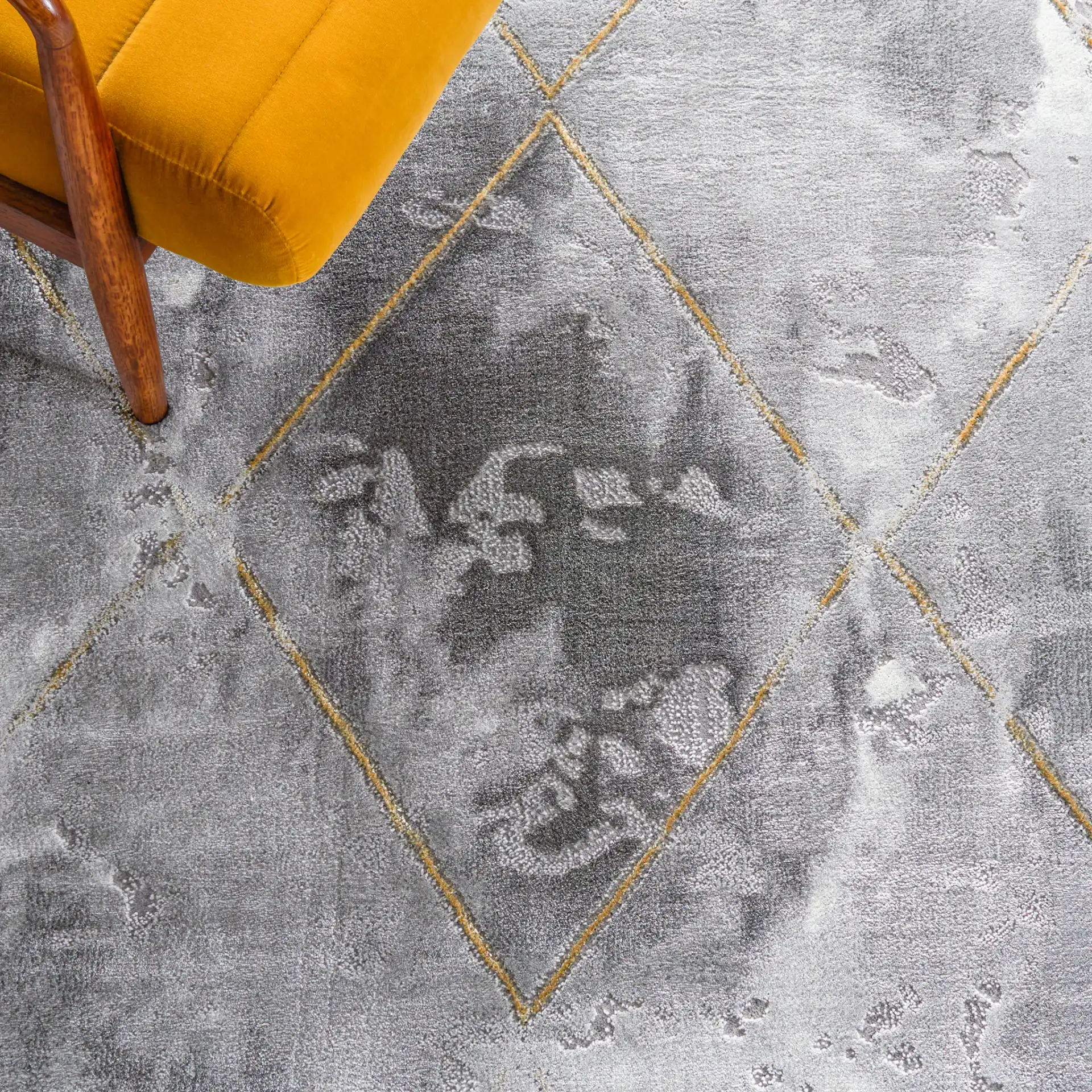 Craft Diamond Grid Rug in Gray / Gold in a styled room