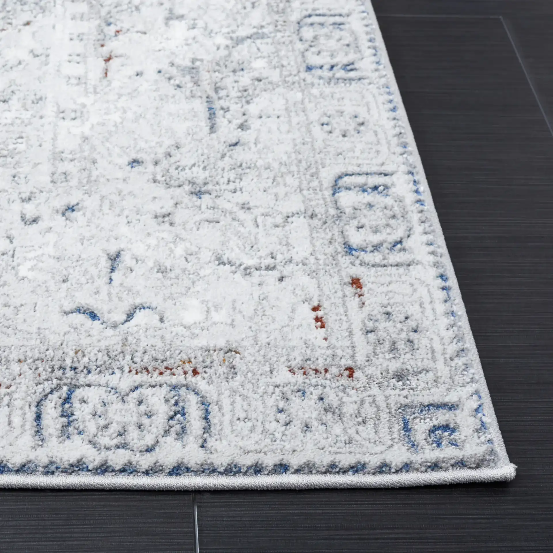 Craft Bordered Medallion Rug in Gray / Blue in a styled room