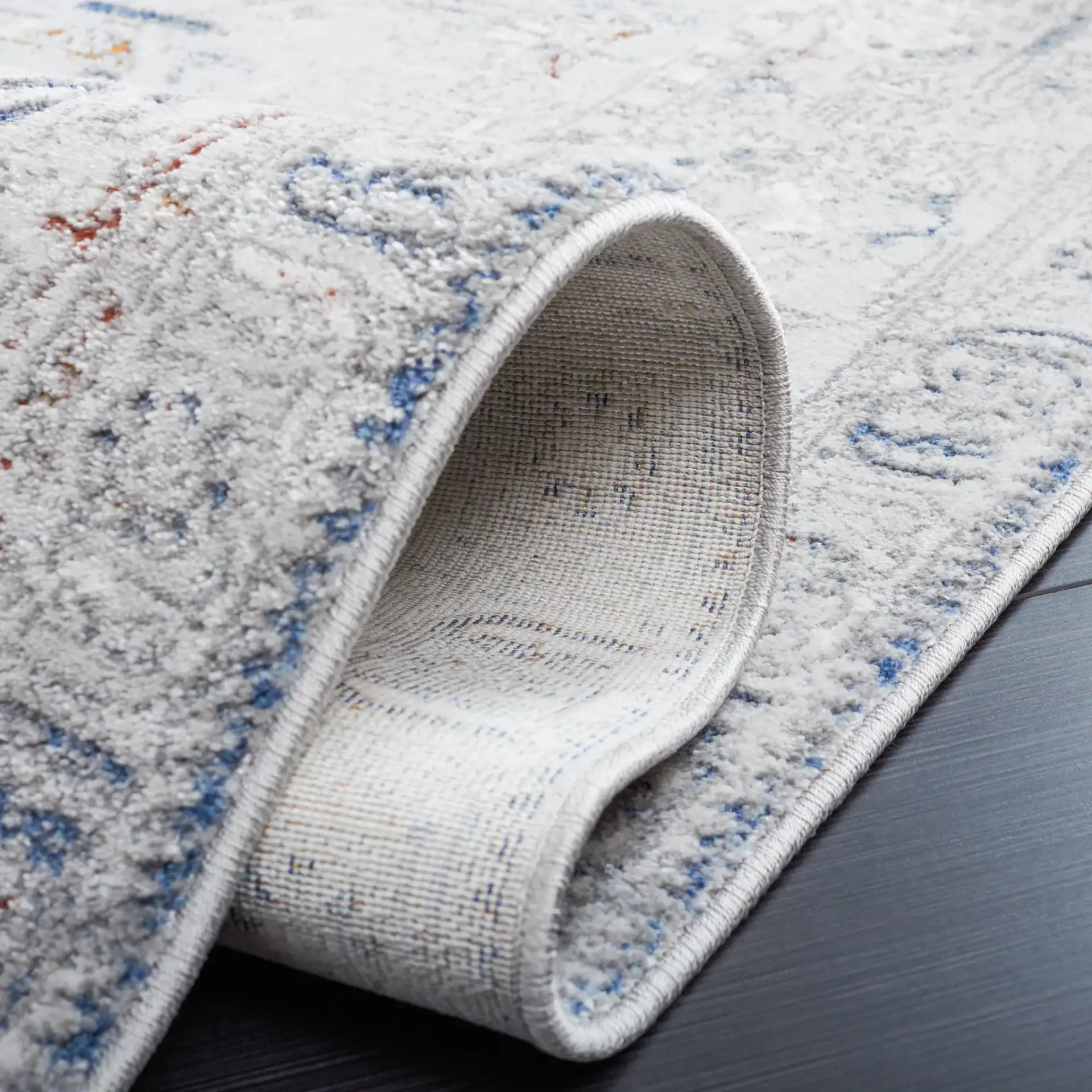 Craft Bordered Medallion Rug in Gray / Blue in a styled room
