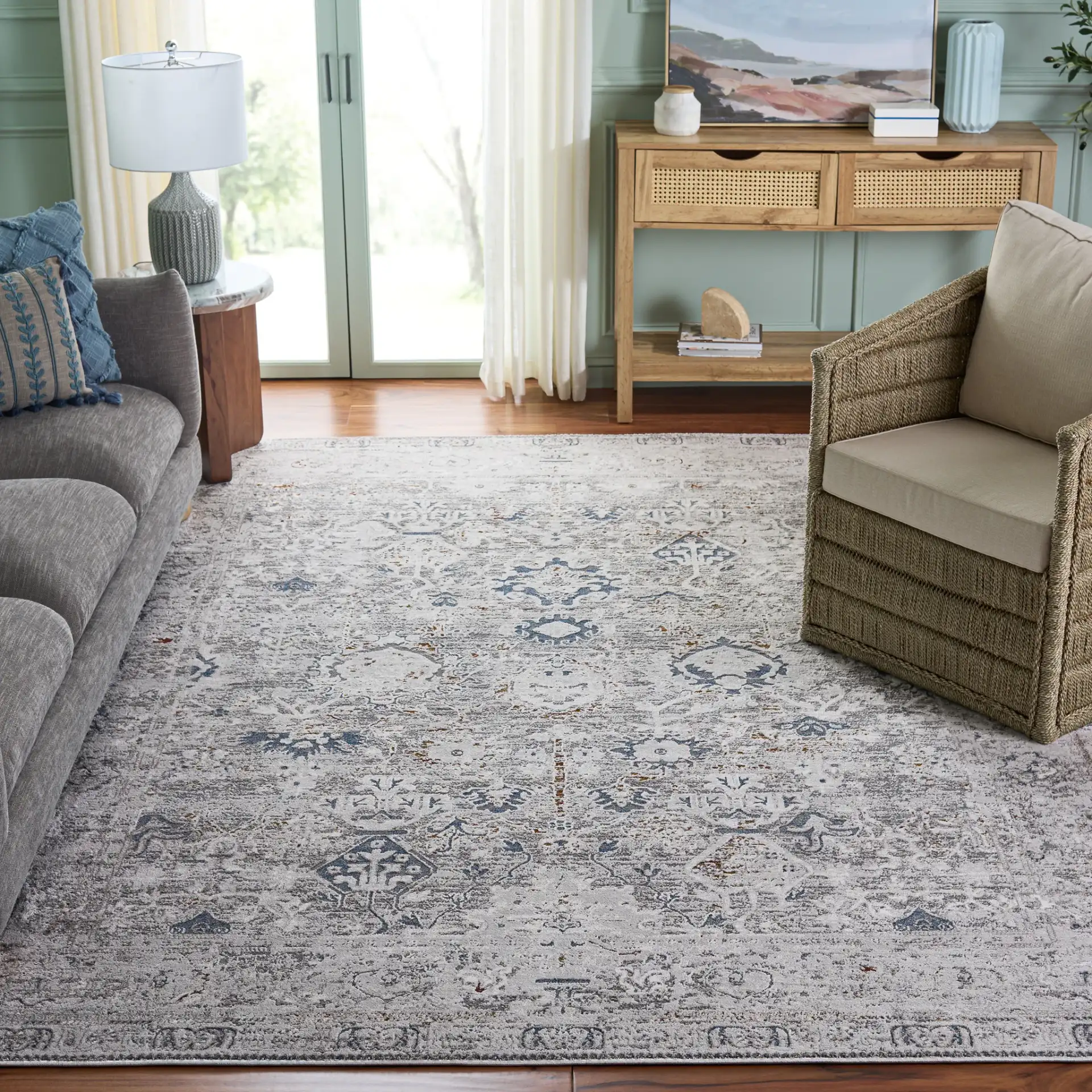 Craft Bordered Medallion Rug in Gray / Blue in a styled room