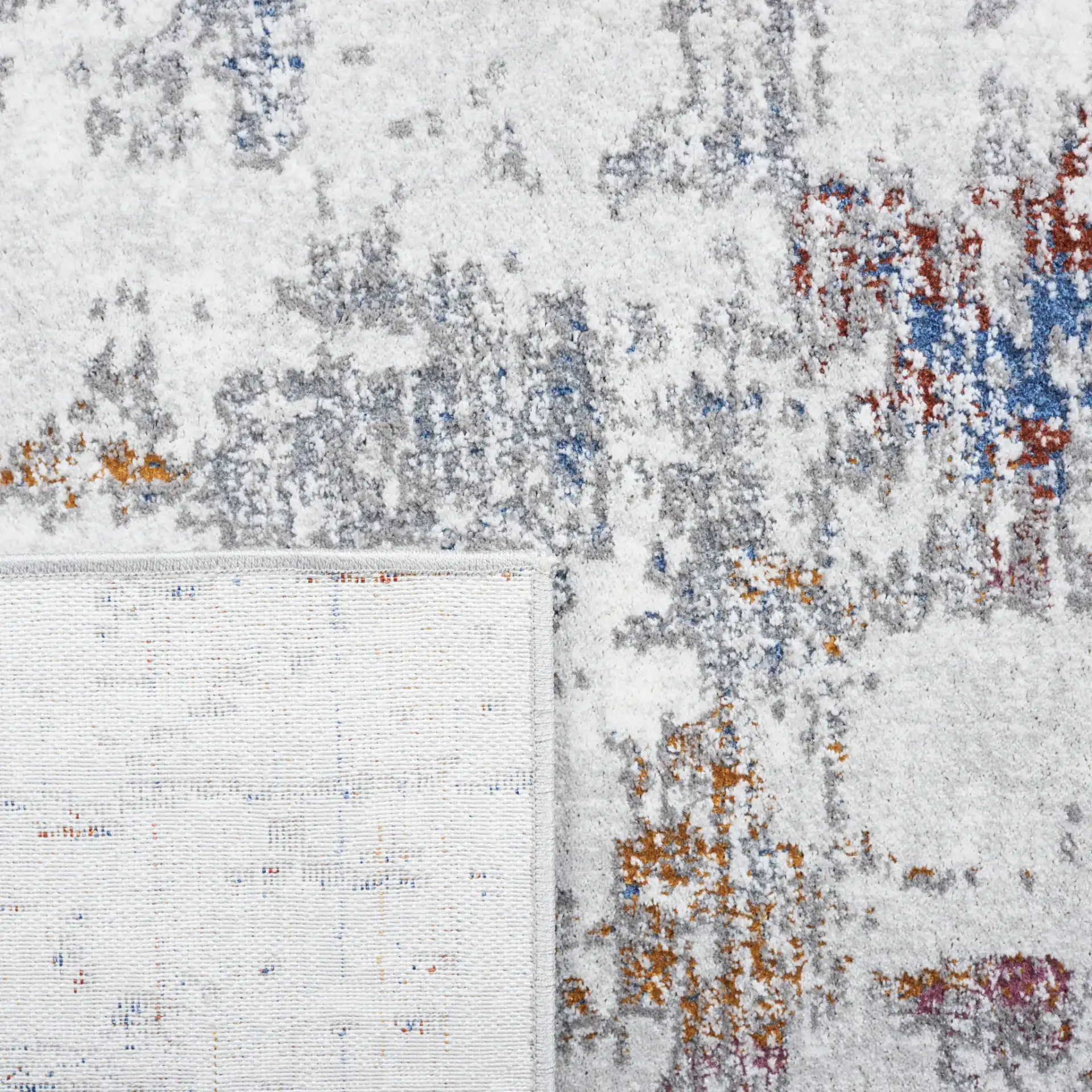 Craft Distressed Abstract Rug in Gray / Gold in a styled room