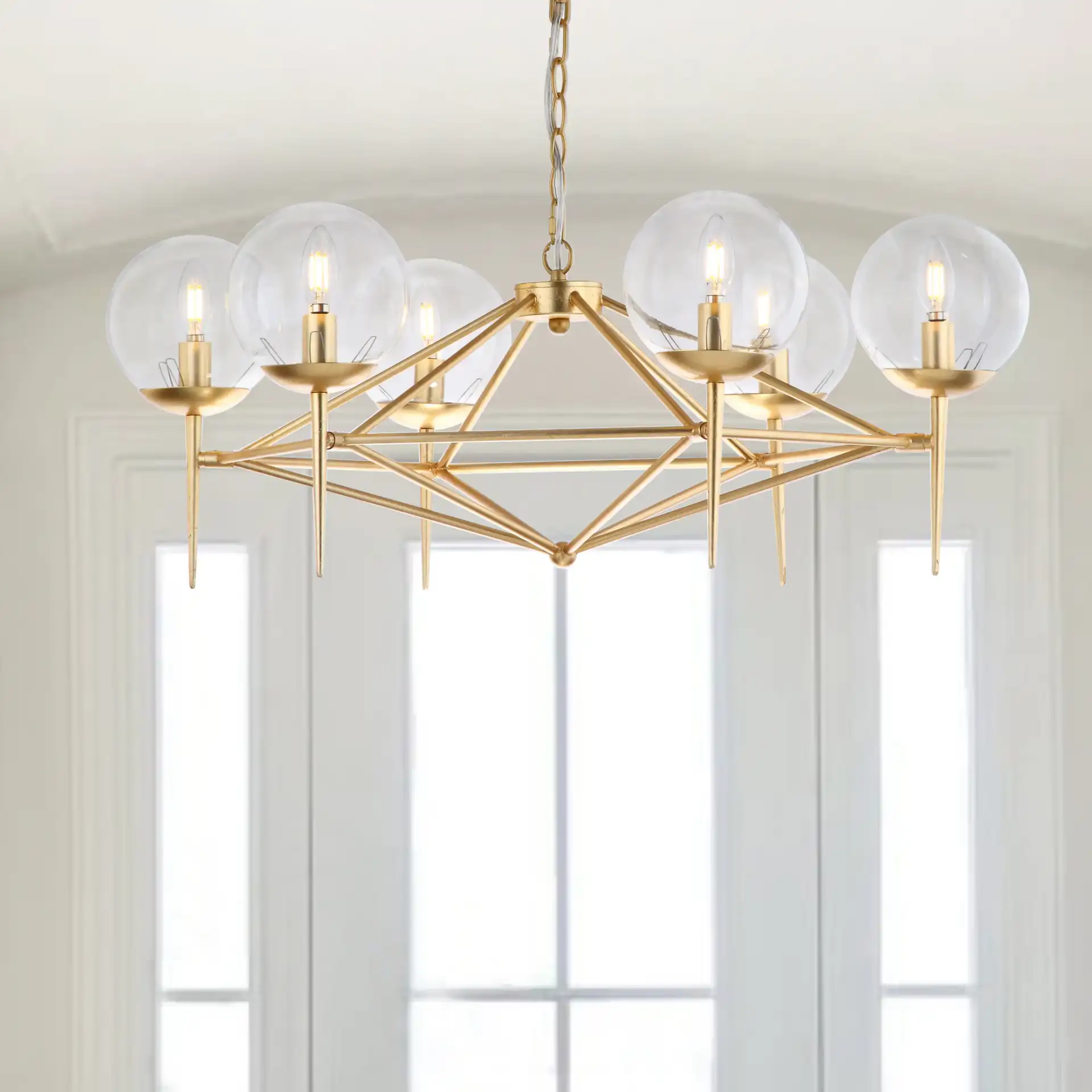 Greyor Six-Light Chandelier in Gold in a styled room