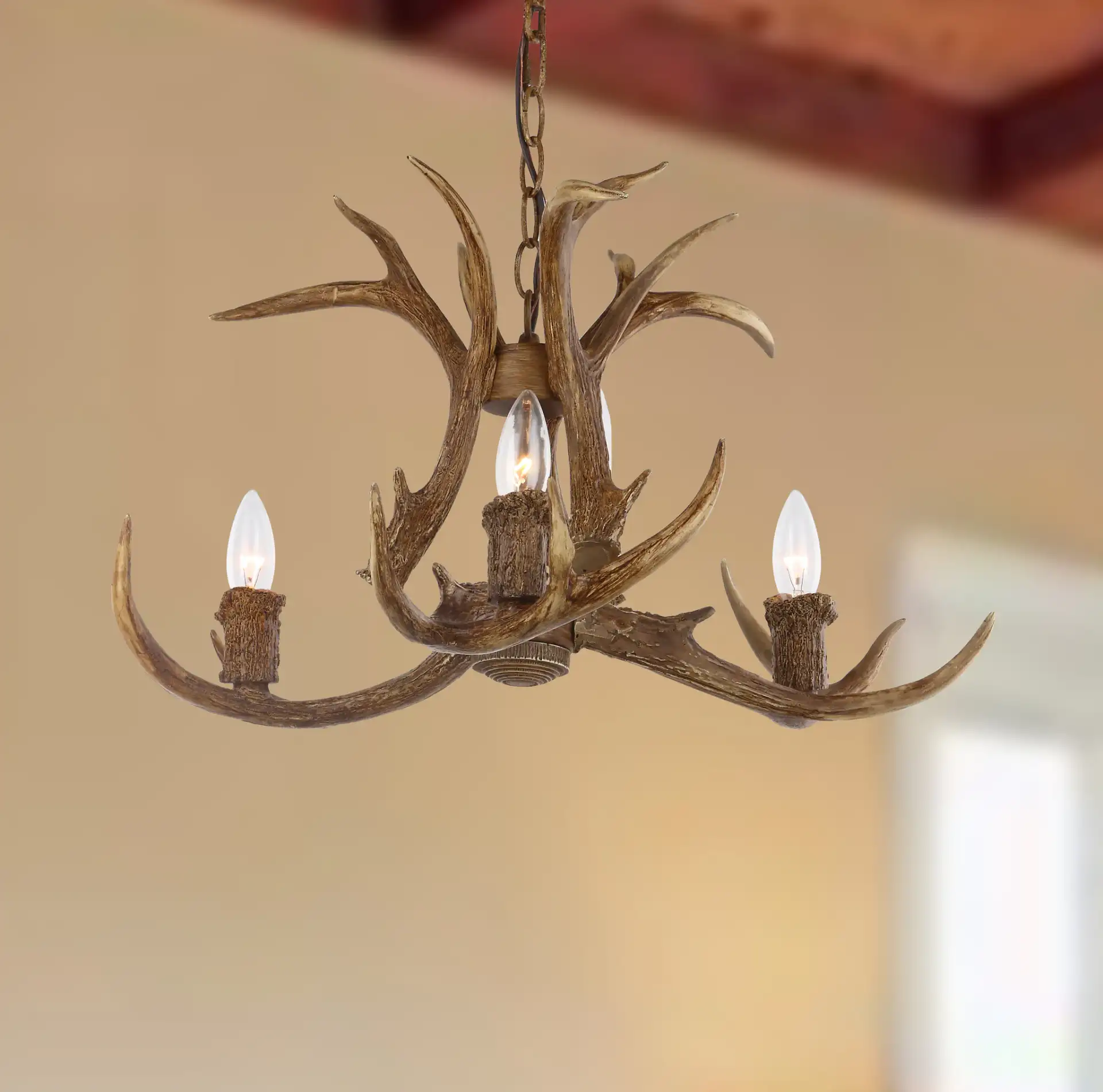 Makani Three-Light Chandelier in Brown in a styled room