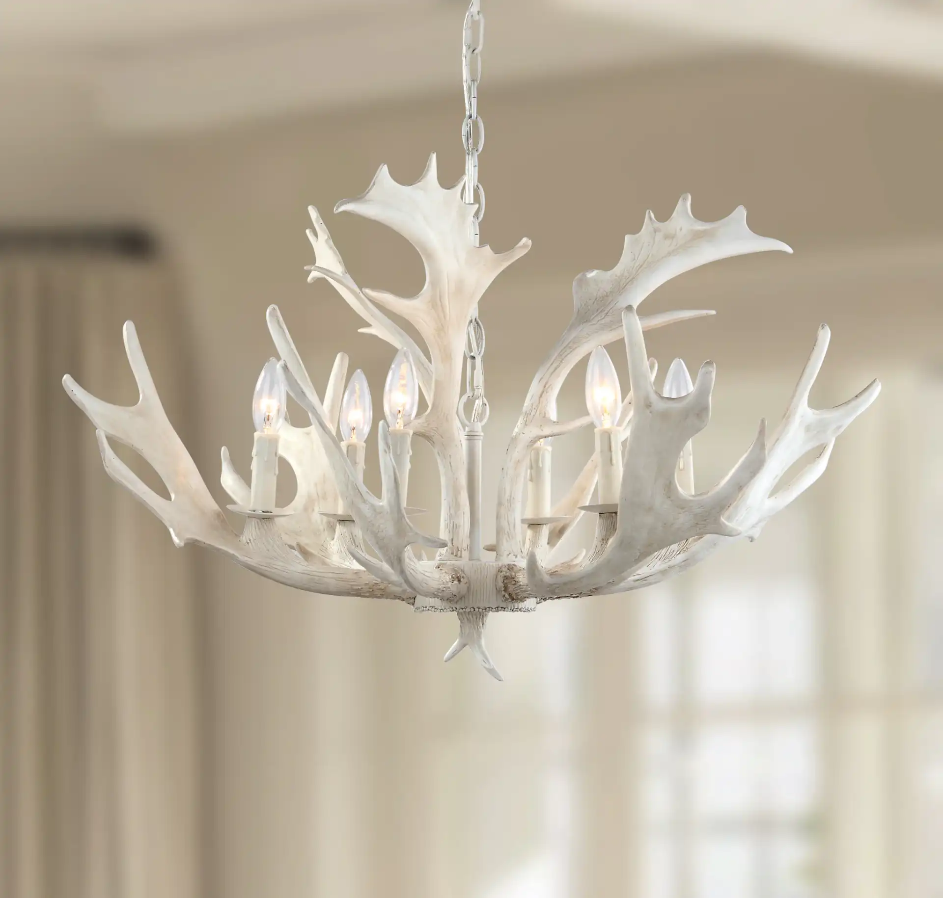 Birch Six-Light Chandelier in White in a styled room