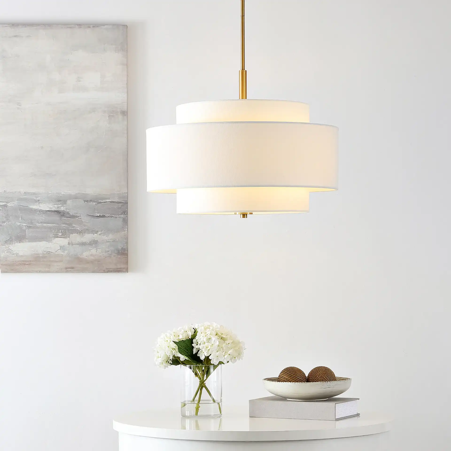 Cambrie Three-Light Chandelier in White / Brass in a styled room