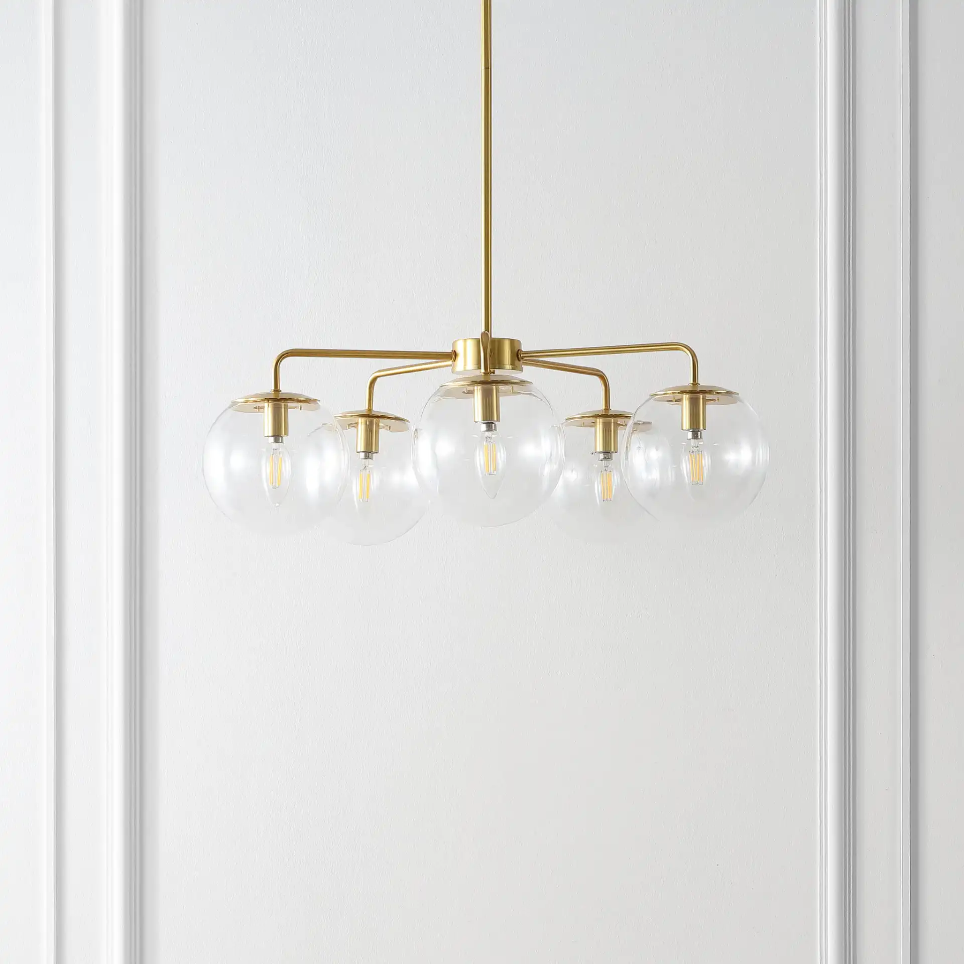 Negara Five-Light Chandelier in Brass / Clear in a styled room