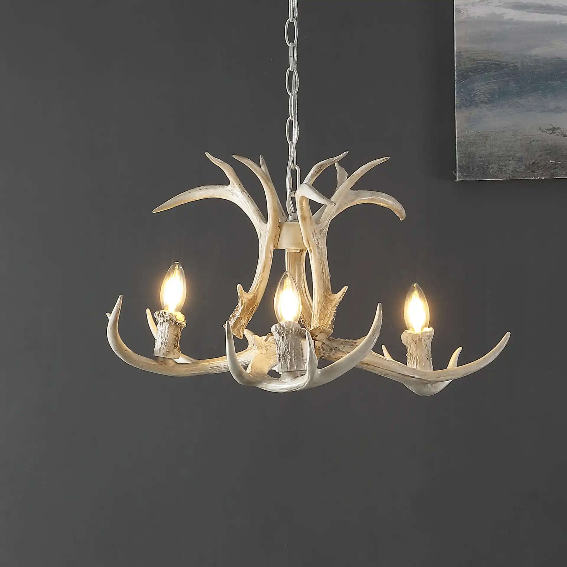Cenwyn Three-Light Chandelier in Antique White in a styled room