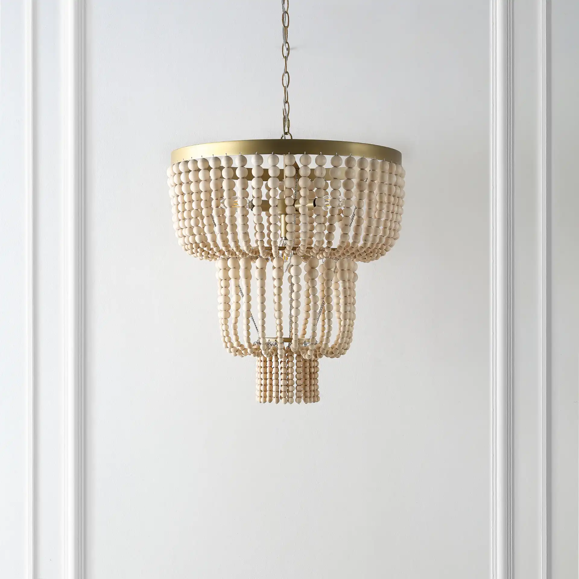 Aleynne Four-Light Chandelier in Brass in a styled room