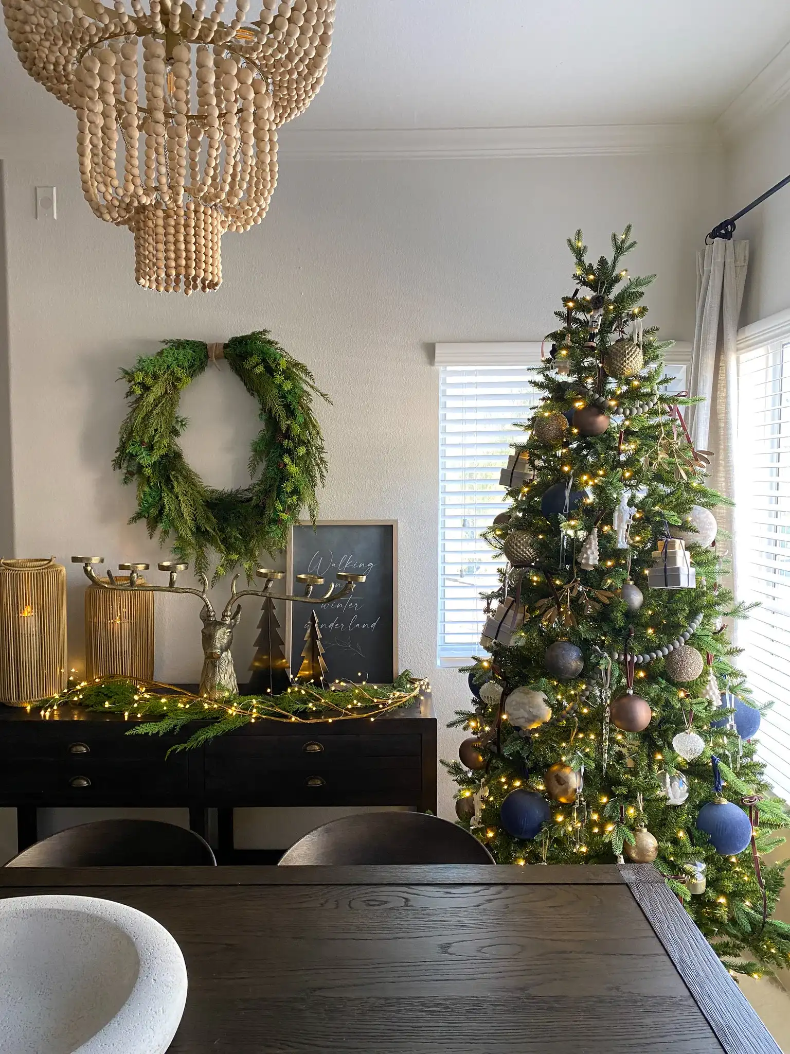 Aleynne Four-Light Chandelier in Brass in a styled room