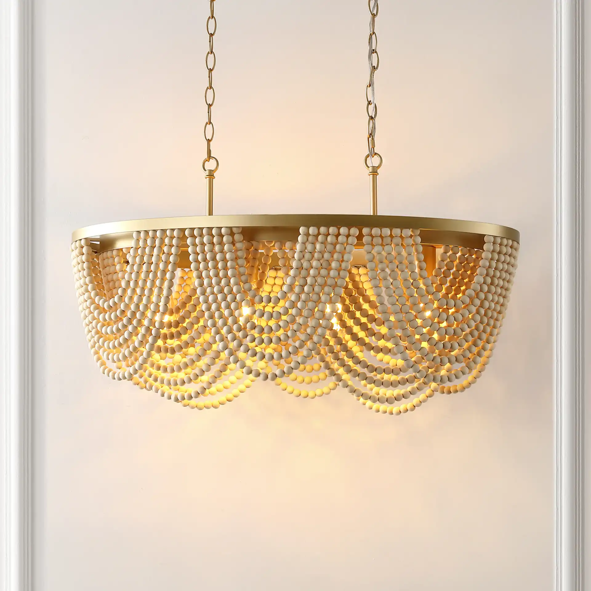 Alluri Four-Light Chandelier in Gold / Natural in a styled room