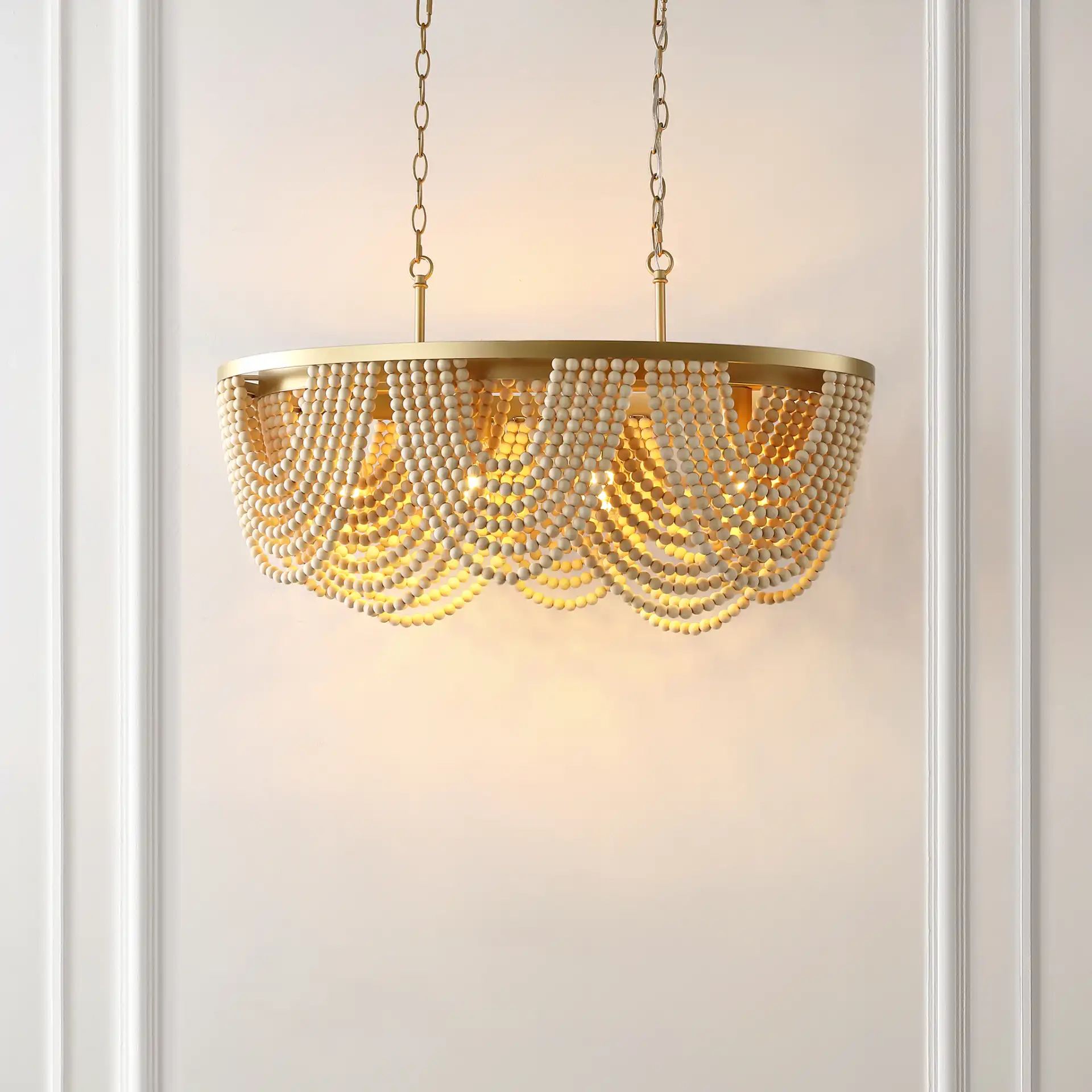 Alluri Four-Light Chandelier in Gold / Natural in a styled room