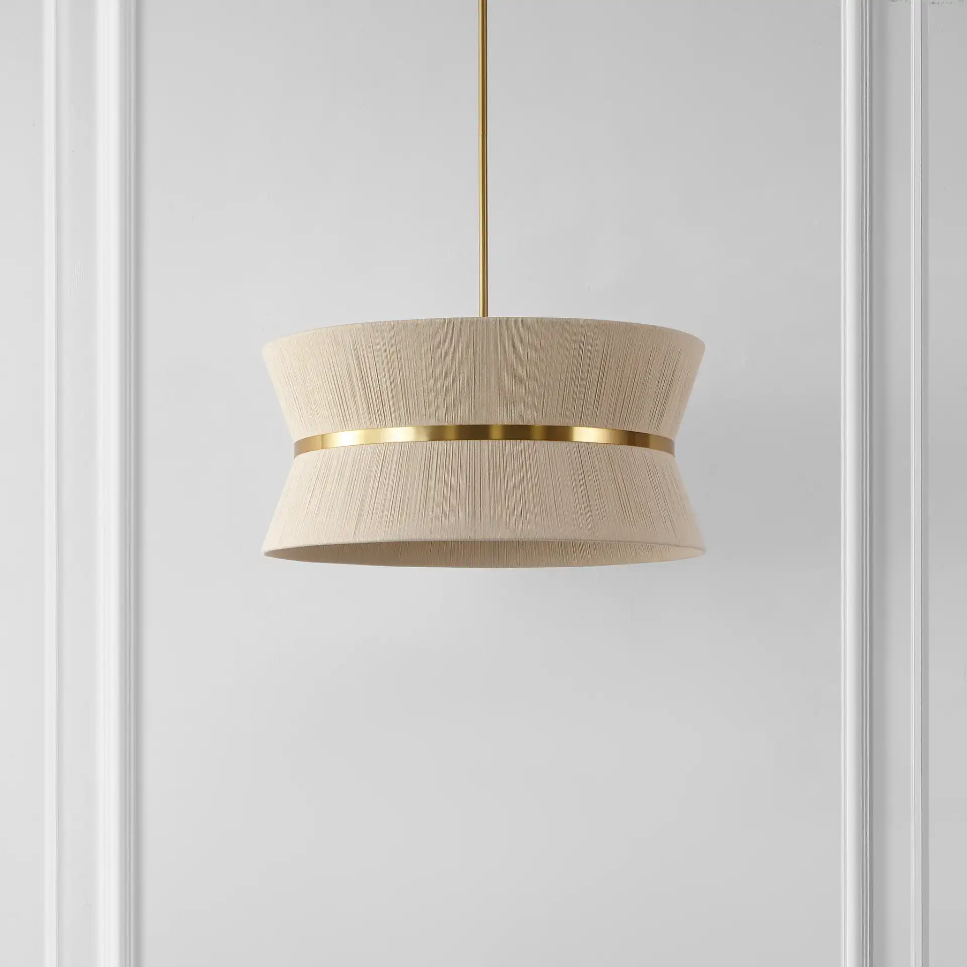 Alma Four-Light Chandelier in Bleached Natural / Brass in a styled room