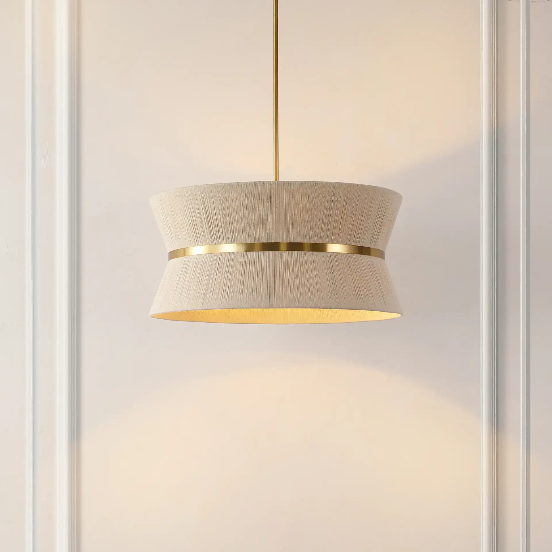 Alma Four-Light Chandelier in Bleached Natural / Brass in a styled room