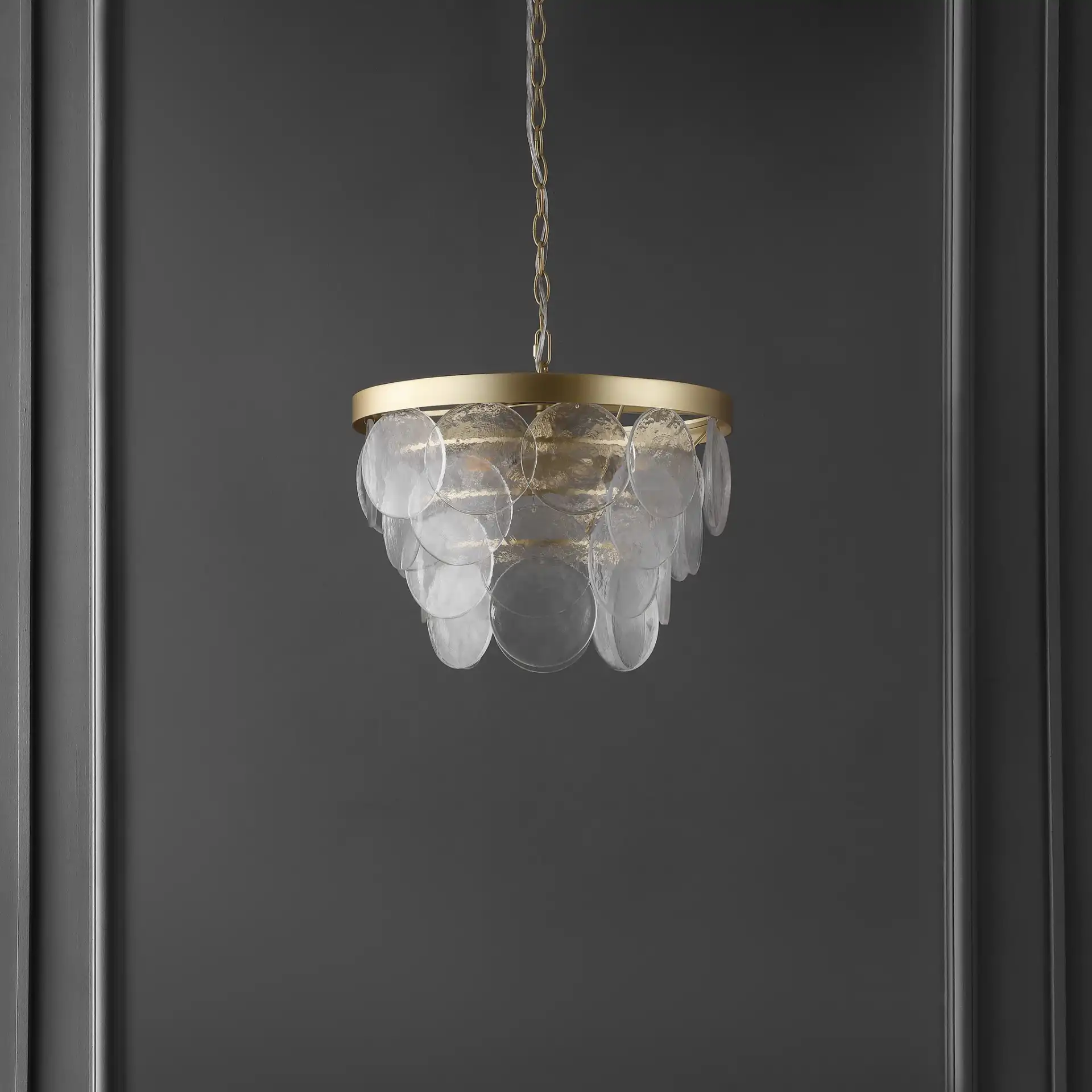 Chrys Three-Light Chandelier in Clear / Gold in a styled room