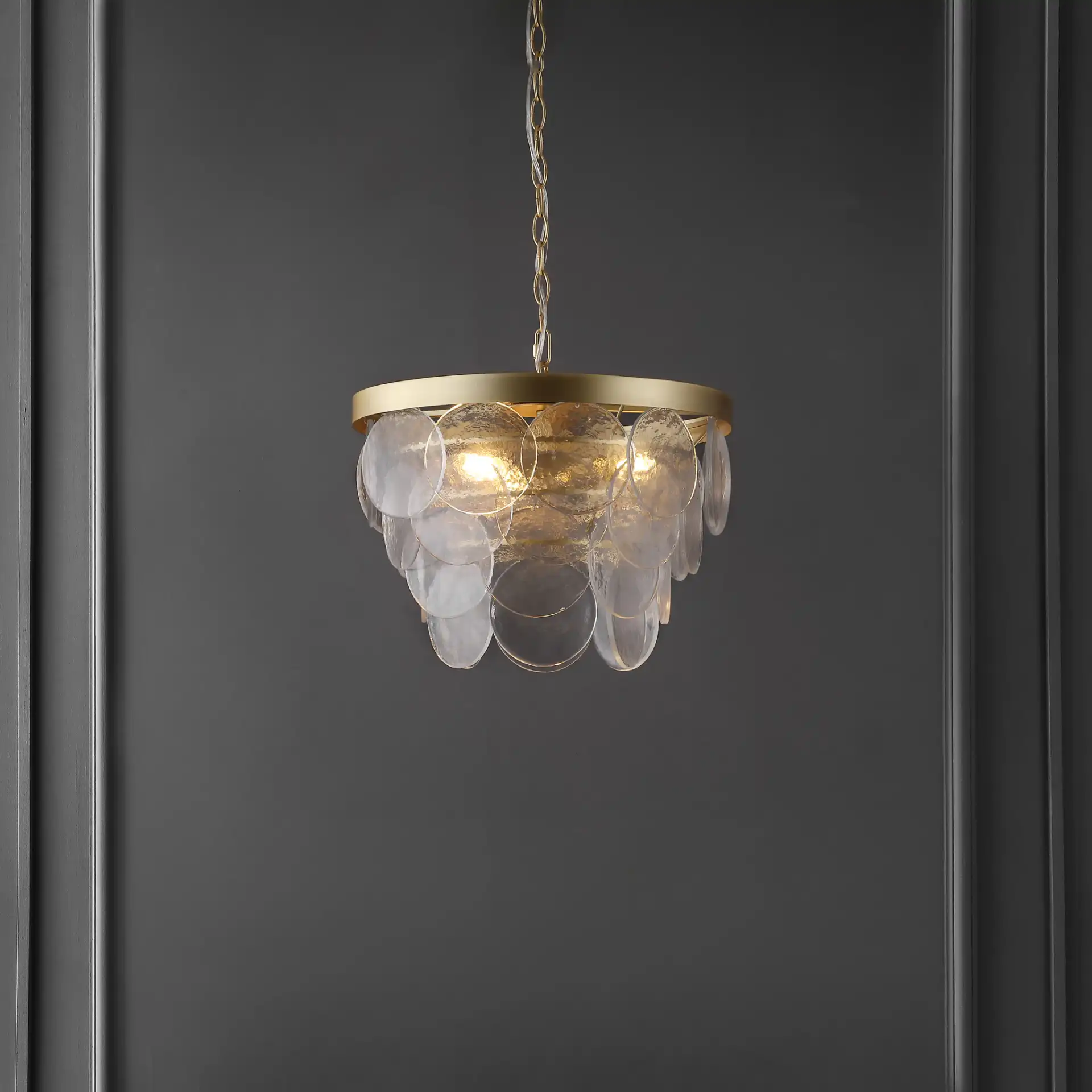 Chrys Three-Light Chandelier in Clear / Gold in a styled room