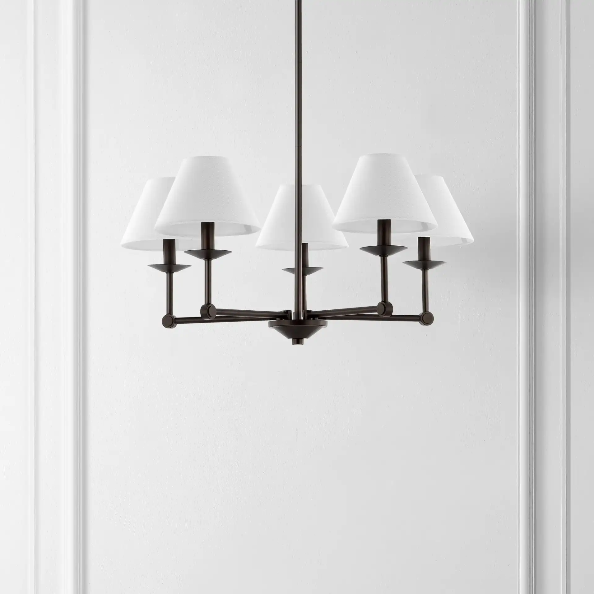Rowley Five-Light Chandelier in Oil Rub Bronze in a styled room