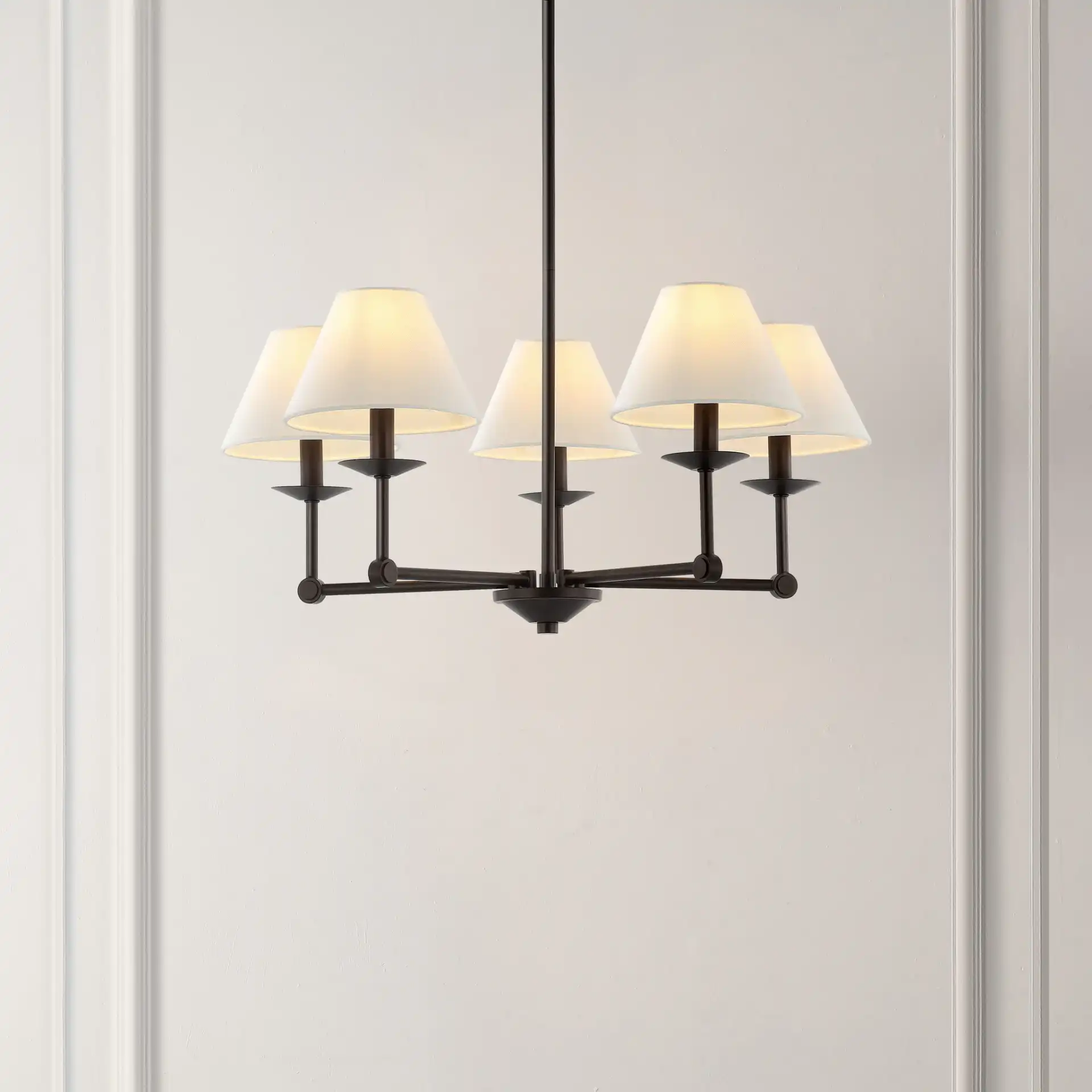 Rowley Five-Light Chandelier in Oil Rub Bronze in a styled room