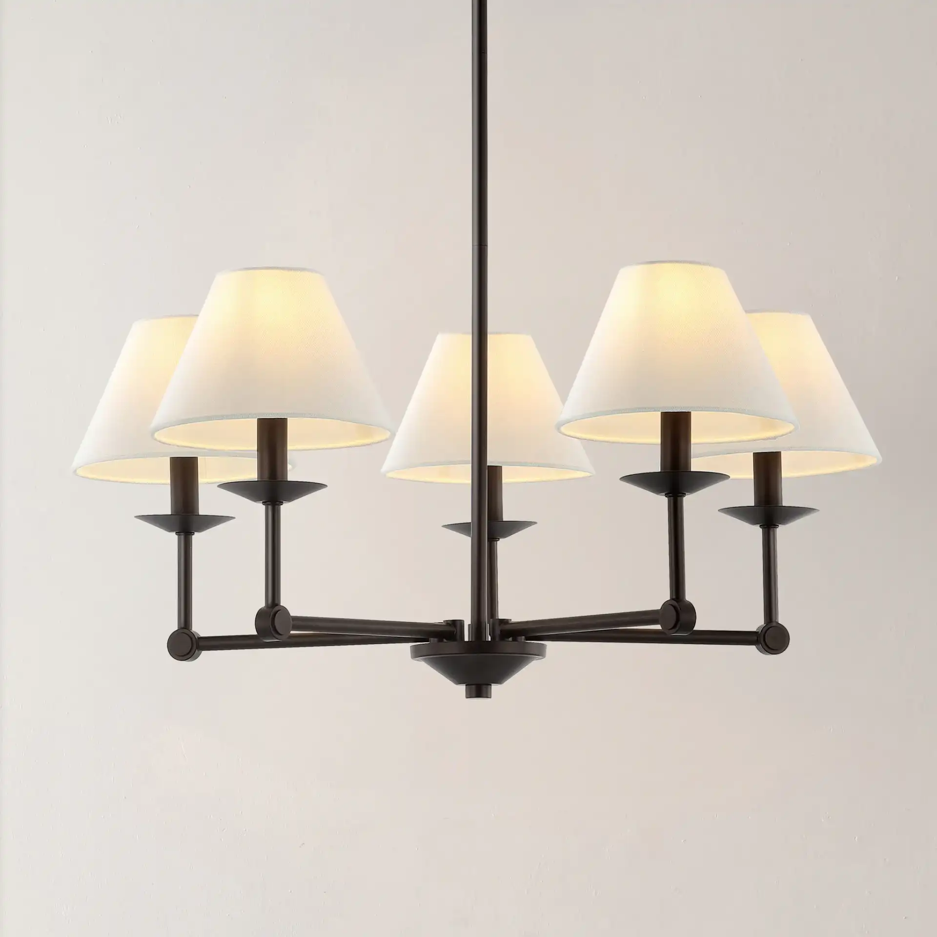 Rowley Five-Light Chandelier in Oil Rub Bronze in a styled room