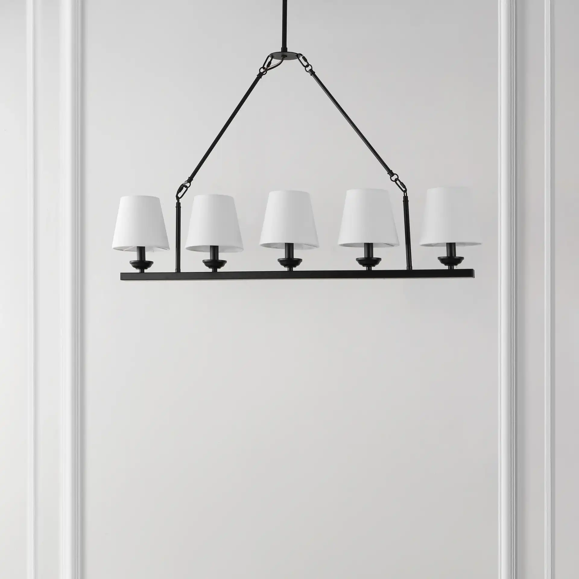 Josphete Five-Light Chandelier in Black in a styled room
