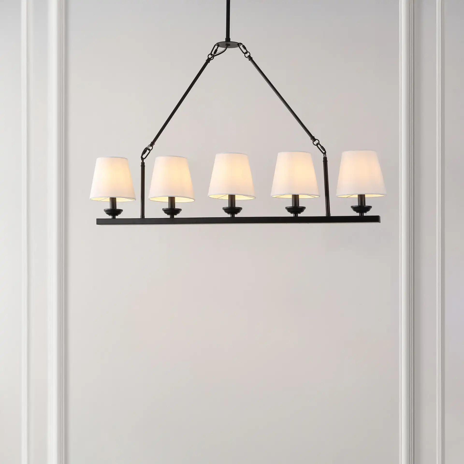 Josphete Five-Light Chandelier in Black in a styled room