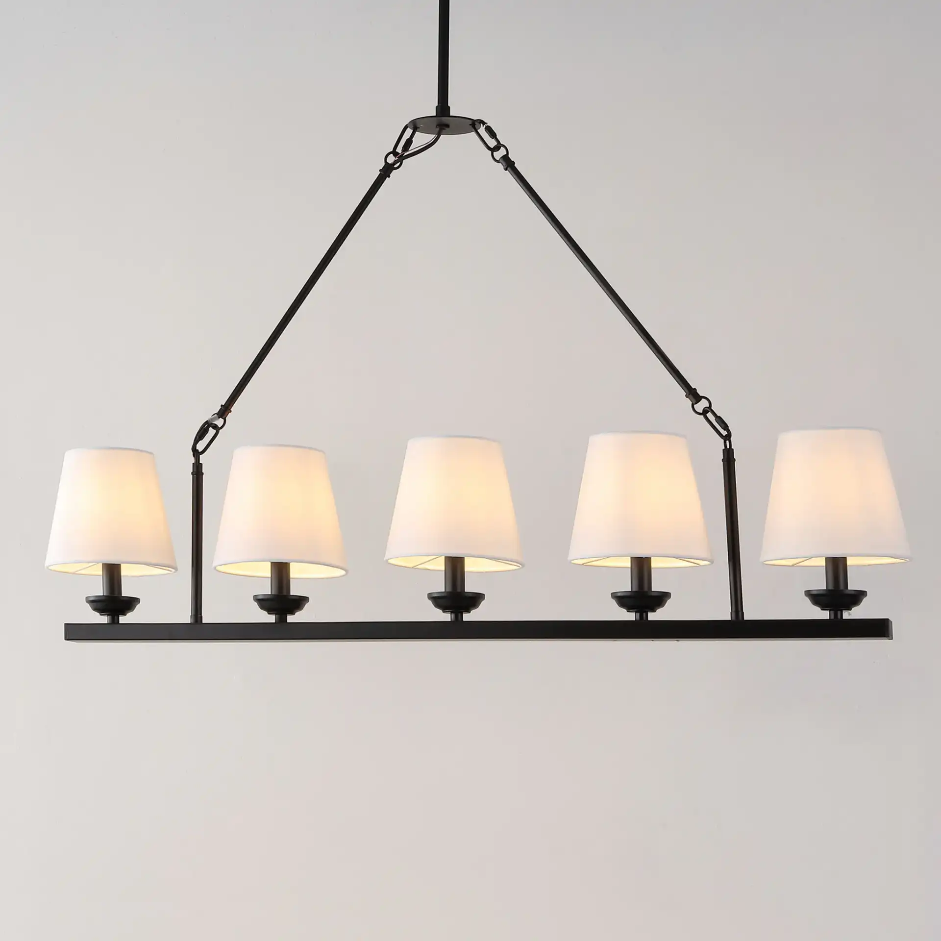 Josphete Five-Light Chandelier in Black in a styled room
