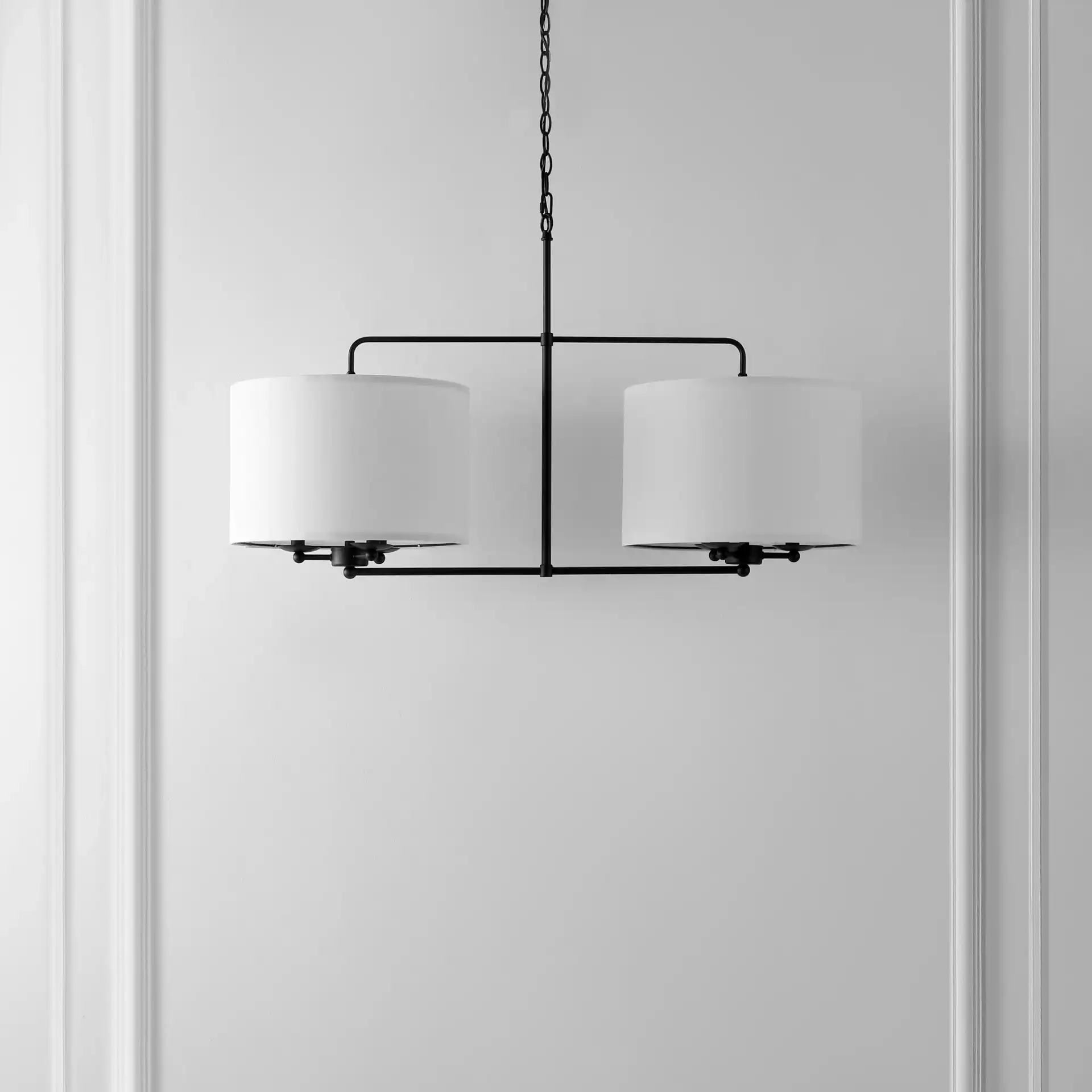 Devney Six-Light Chandelier in Black in a styled room