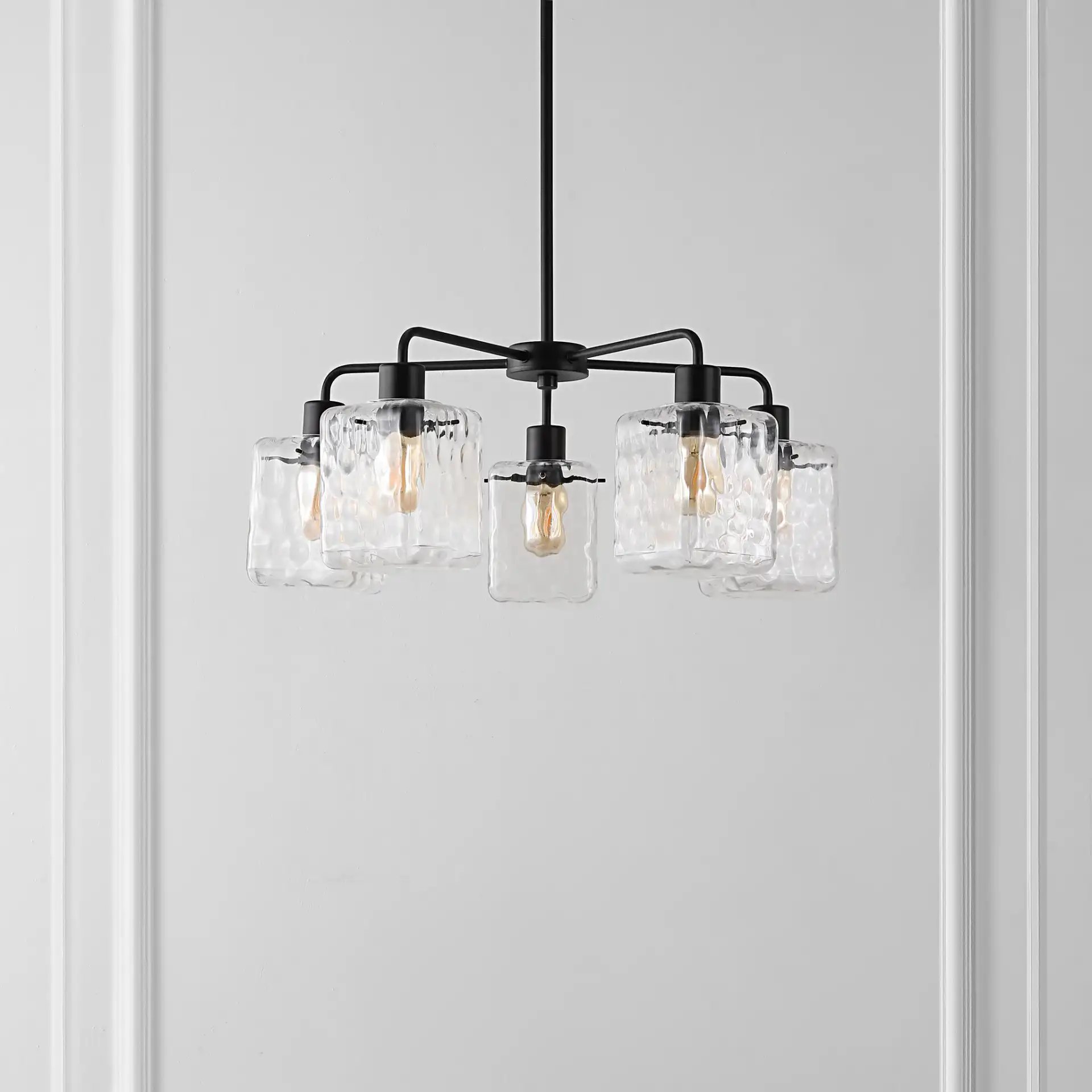 Jameson Five-Light Chandelier in Oil Rub Bronze in a styled room