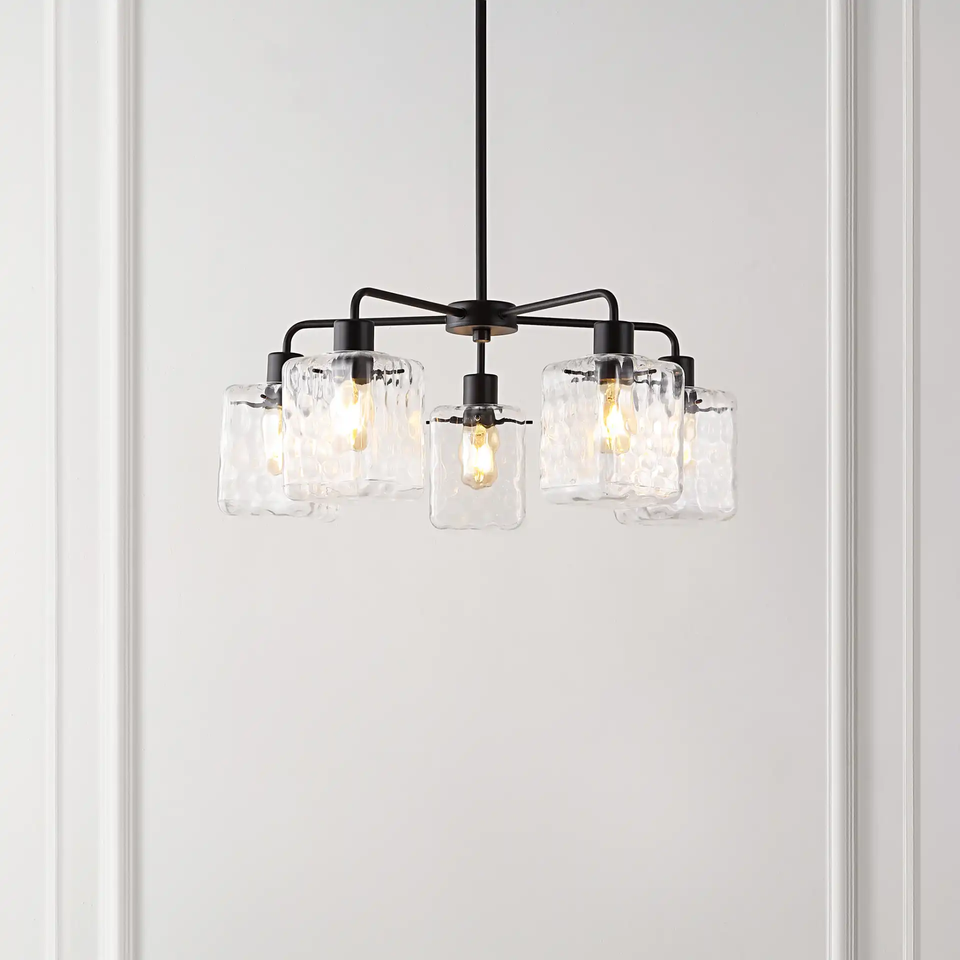 Jameson Five-Light Chandelier in Oil Rub Bronze in a styled room