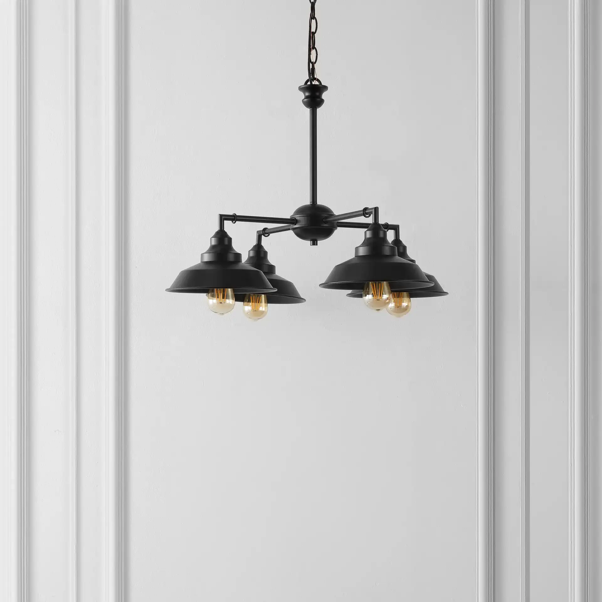 Westlyn Four-Light Chandelier in Black in a styled room