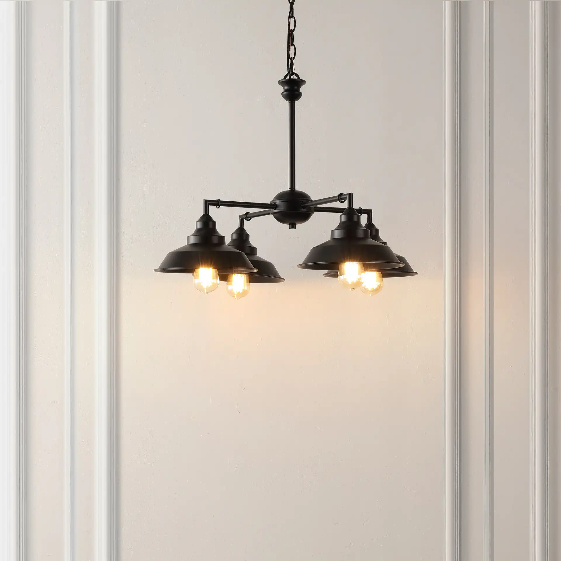 Westlyn Four-Light Chandelier in Black in a styled room