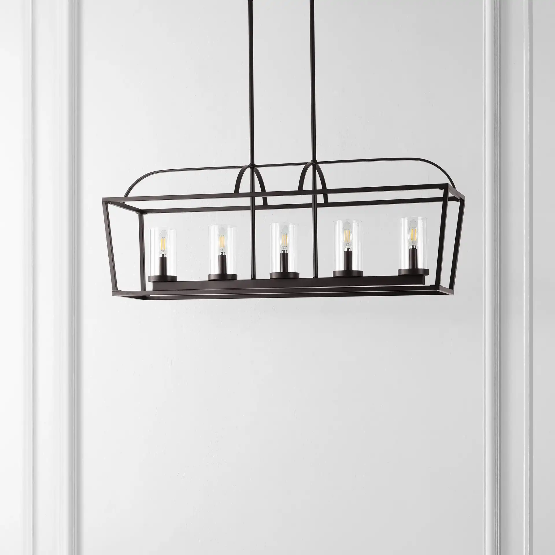 Manning Five-Light Chandelier in Oil Rub Bronze in a styled room