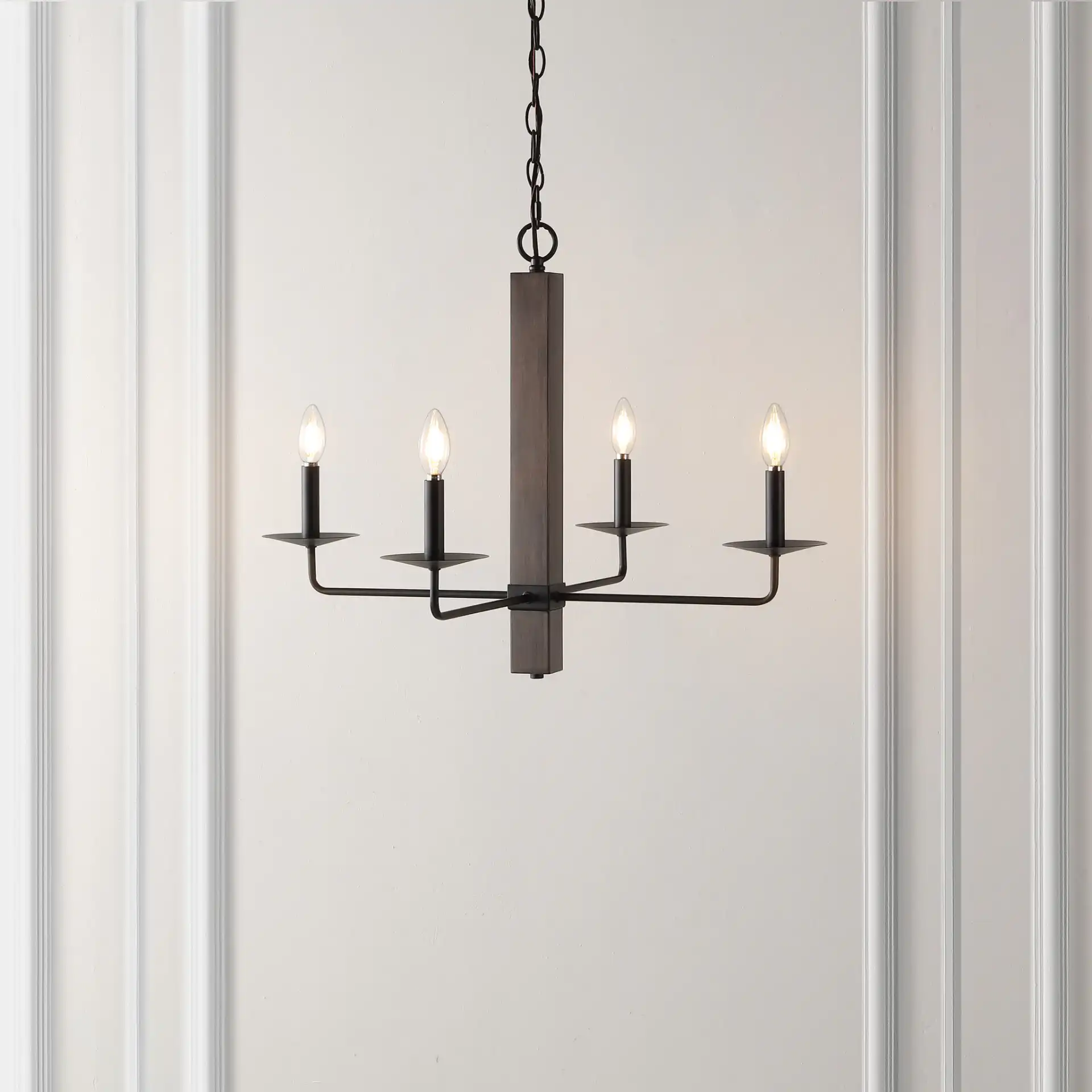 Oakly Four-Light Chandelier in Black / Walnut in a styled room