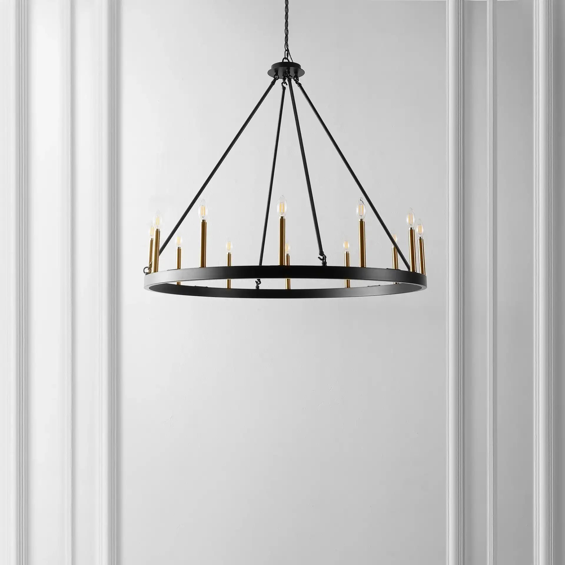 Taelor Twelve-Light Chandelier in Black / Gold in a styled room
