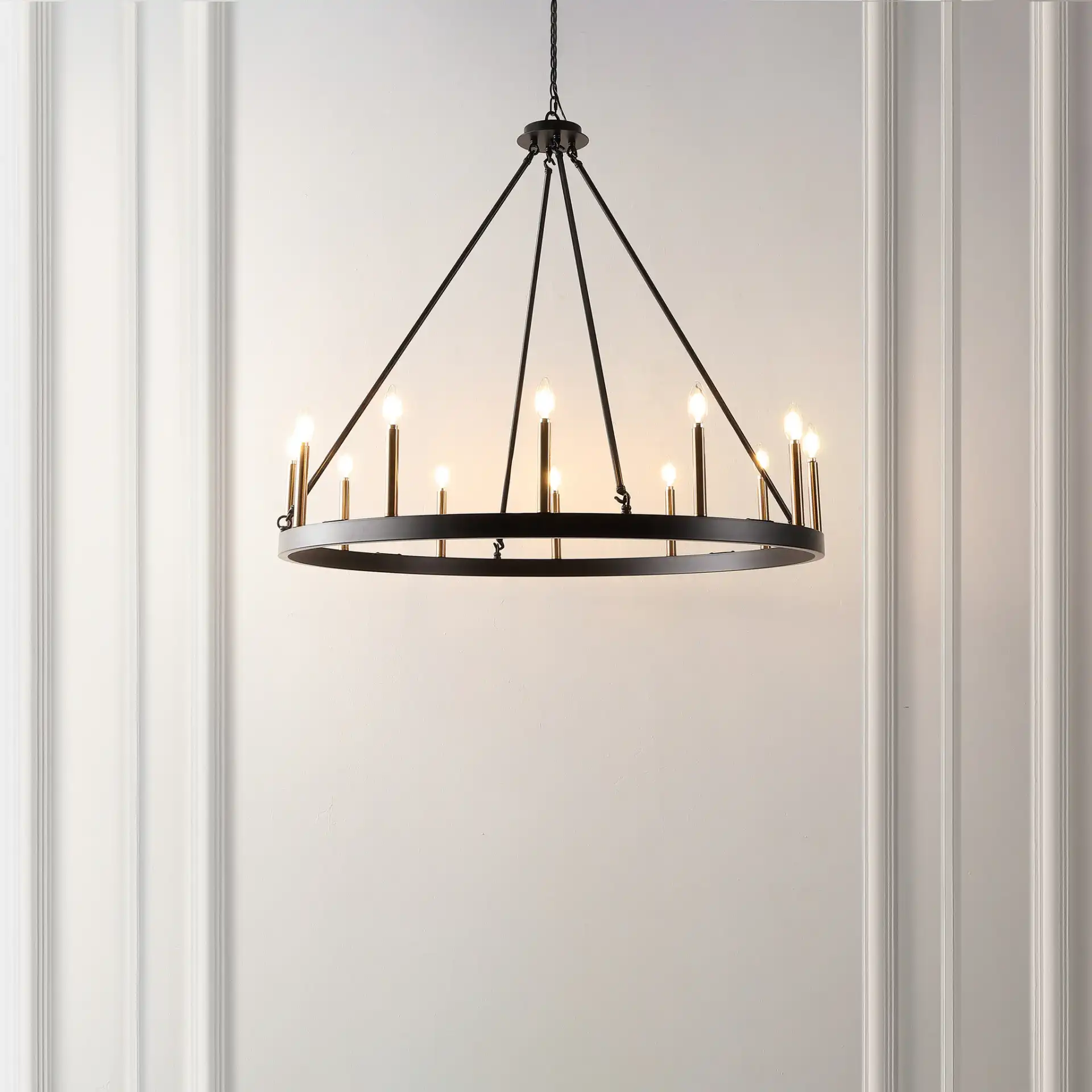 Taelor Twelve-Light Chandelier in Black / Gold in a styled room