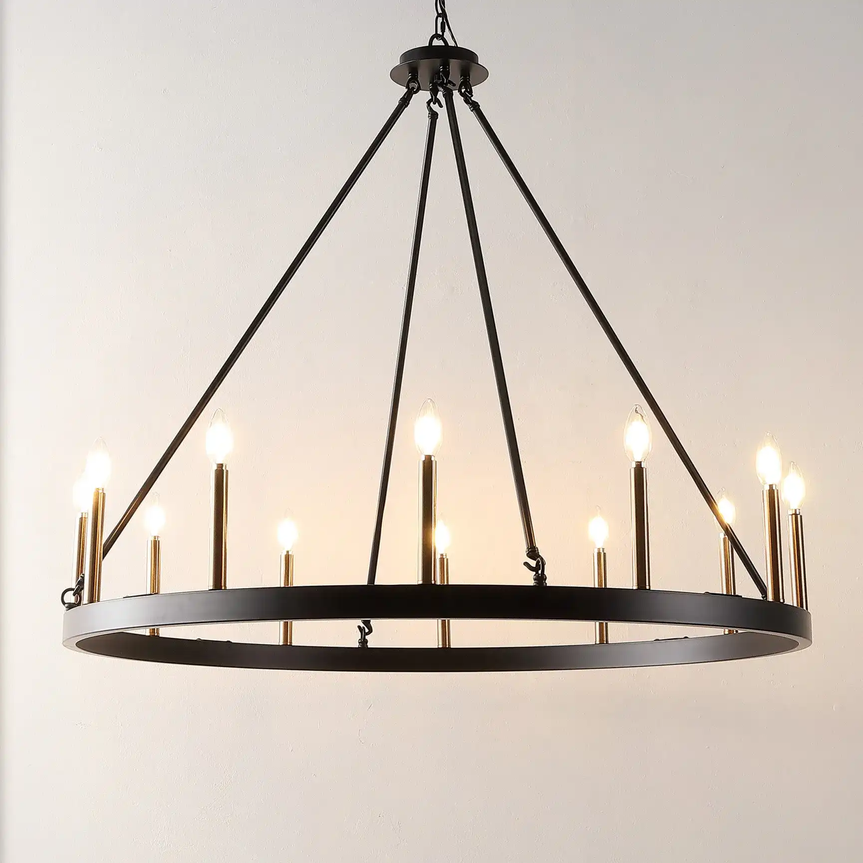 Taelor Twelve-Light Chandelier in Black / Gold in a styled room