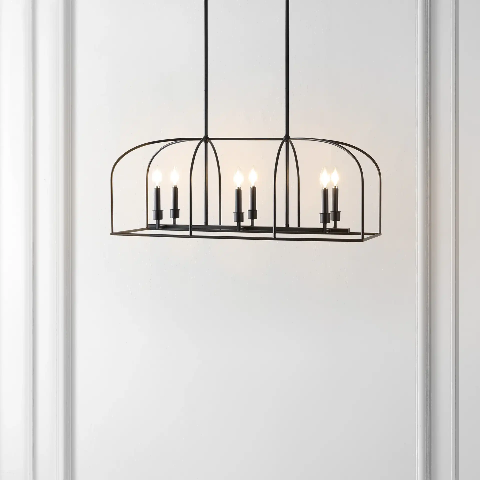 Bryndan Six-Light Chandelier in Black in a styled room