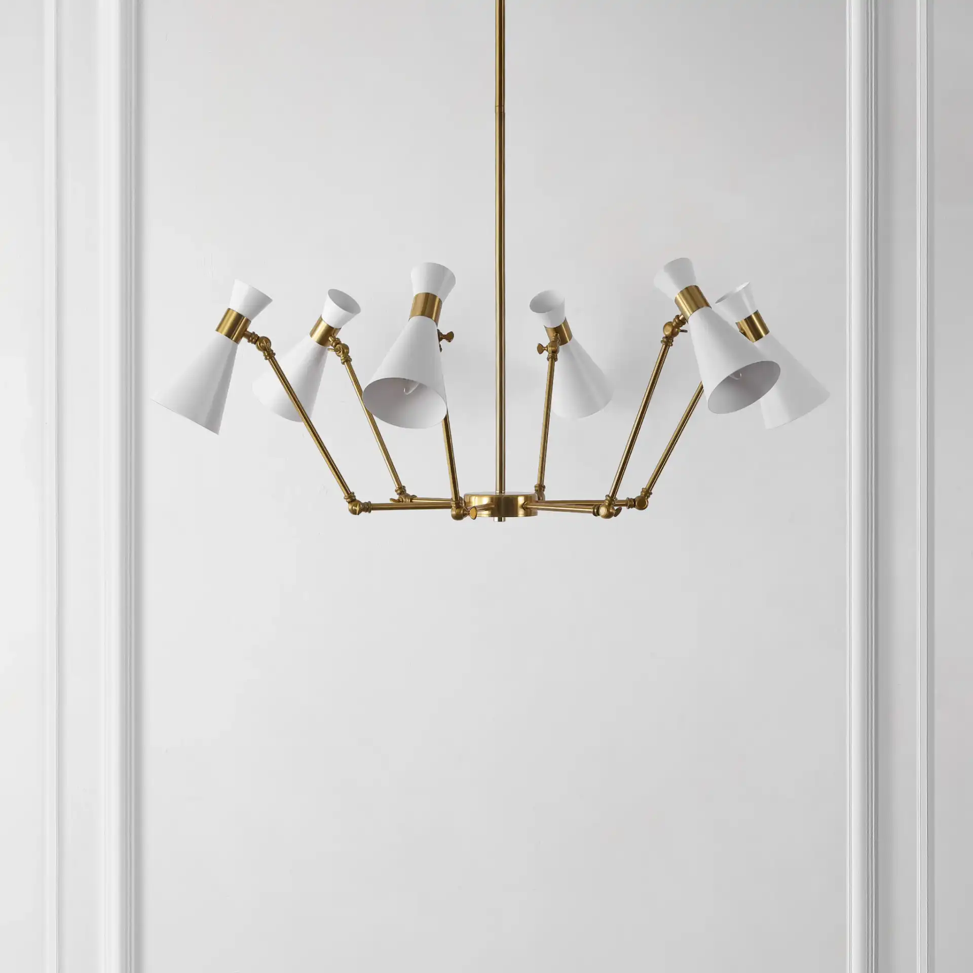 Shiraz Six-Light Chandelier in Brass / White in a styled room