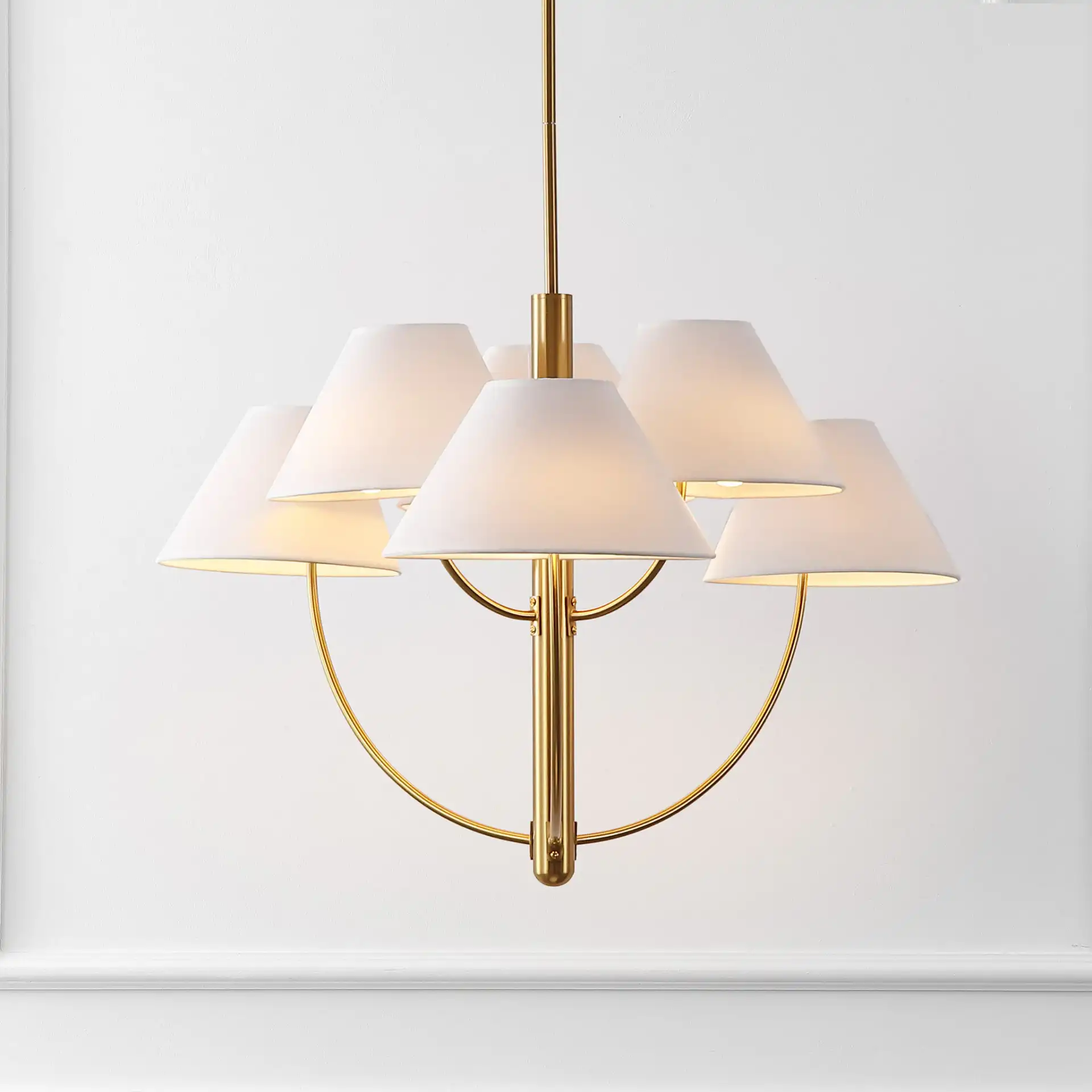 Madsen Six-Light Chandelier in Brass in a styled room