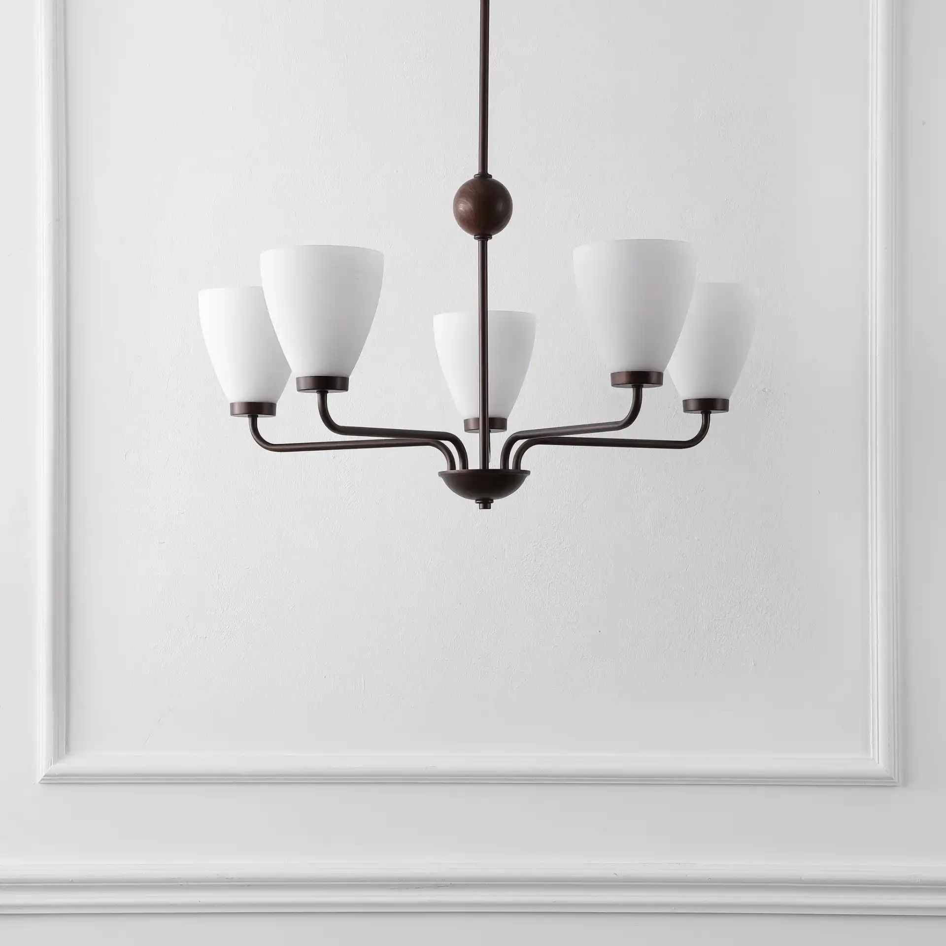 Wynne Five-Light Chandelier in Antique Brown in a styled room