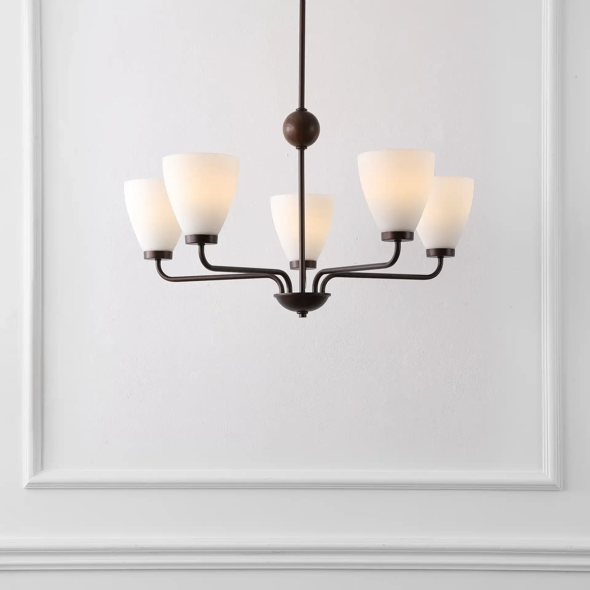 Wynne Five-Light Chandelier in Antique Brown in a styled room