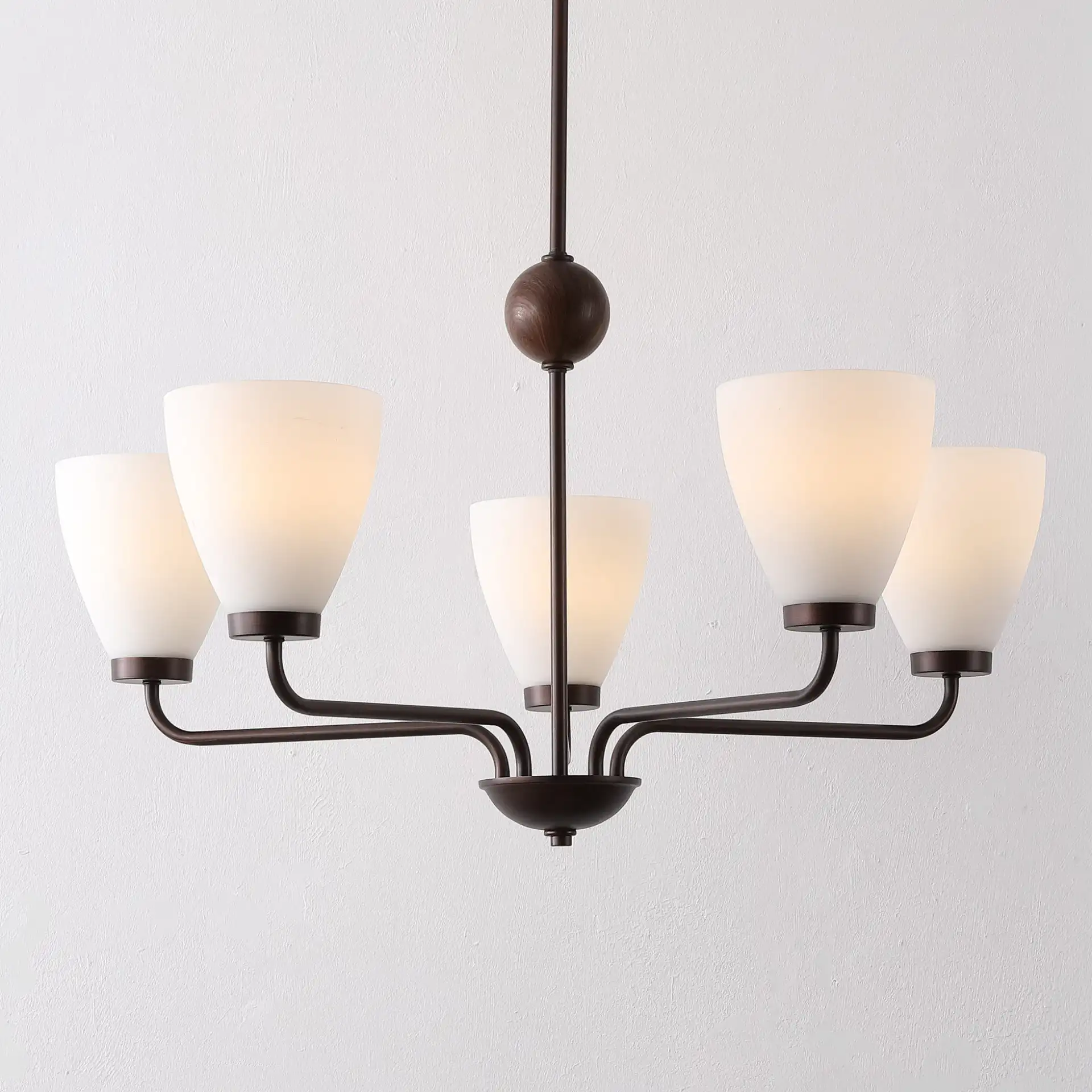 Wynne Five-Light Chandelier in Antique Brown in a styled room