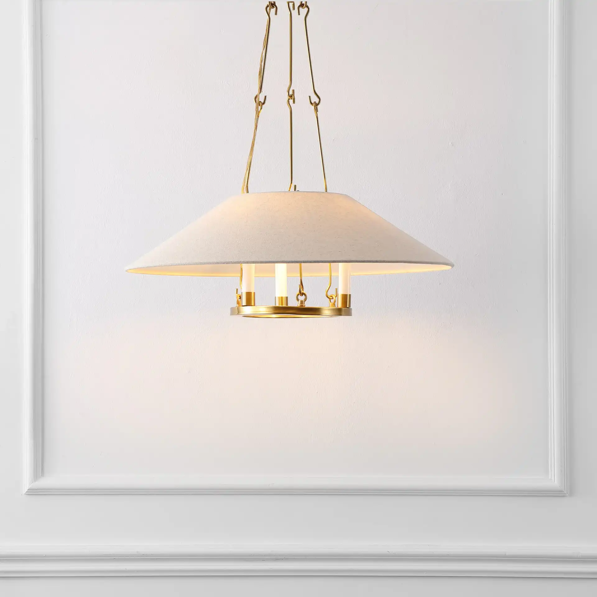 Pamila Three-Light Chandelier in Brass in a styled room