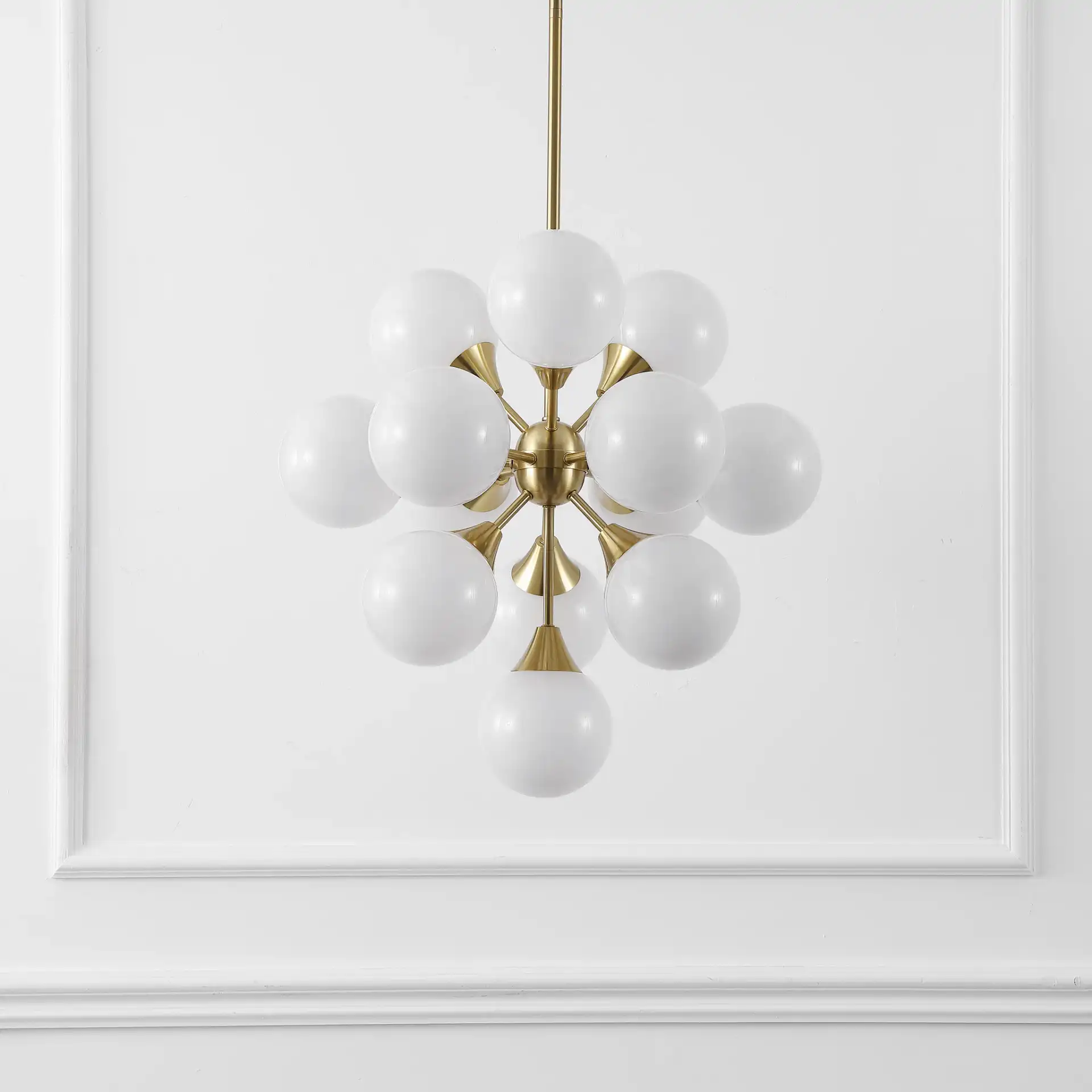 Delvine Thirteen-Light Chandelier in Brass / White in a styled room