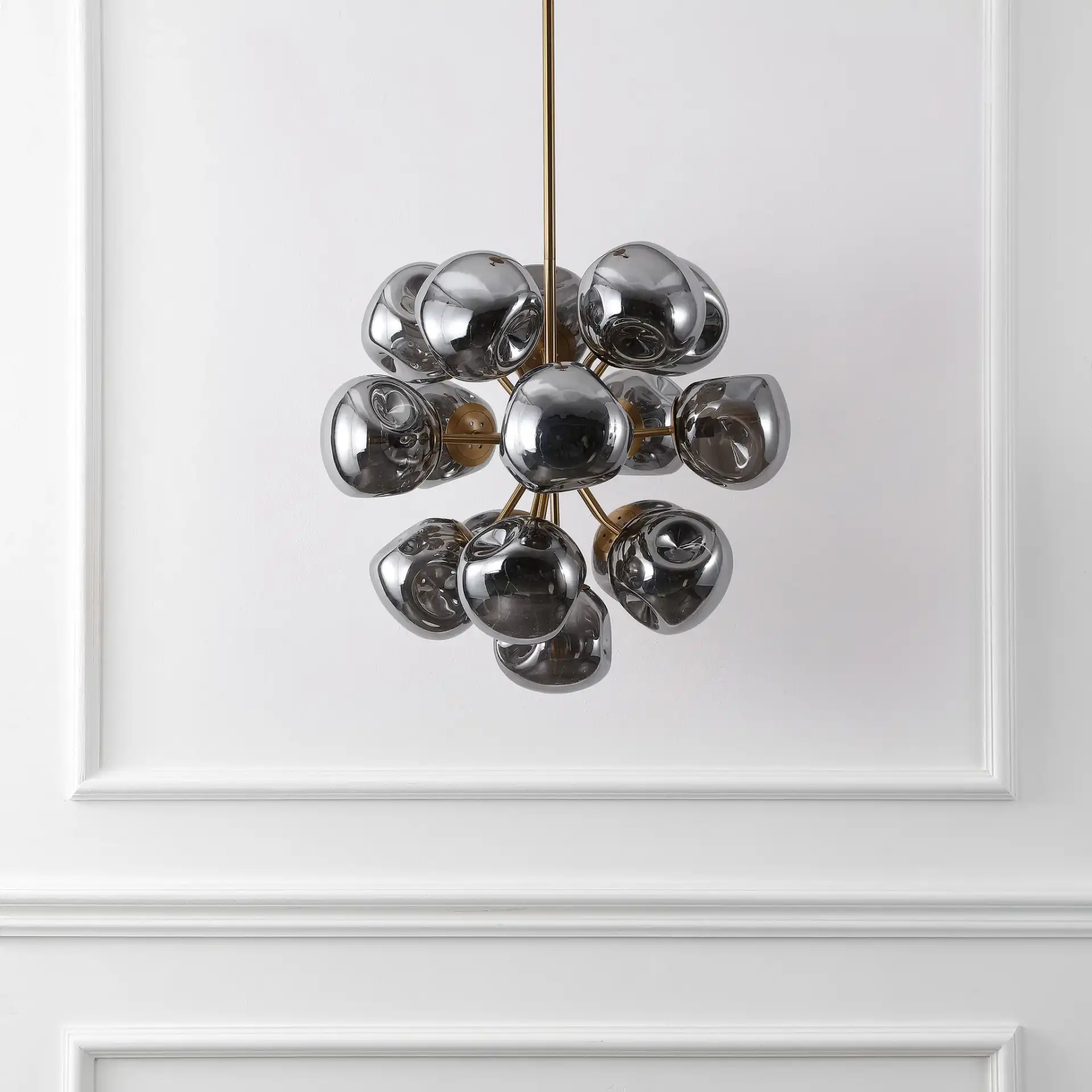 Paulia Chandelier in Chrome / Brass in a styled room