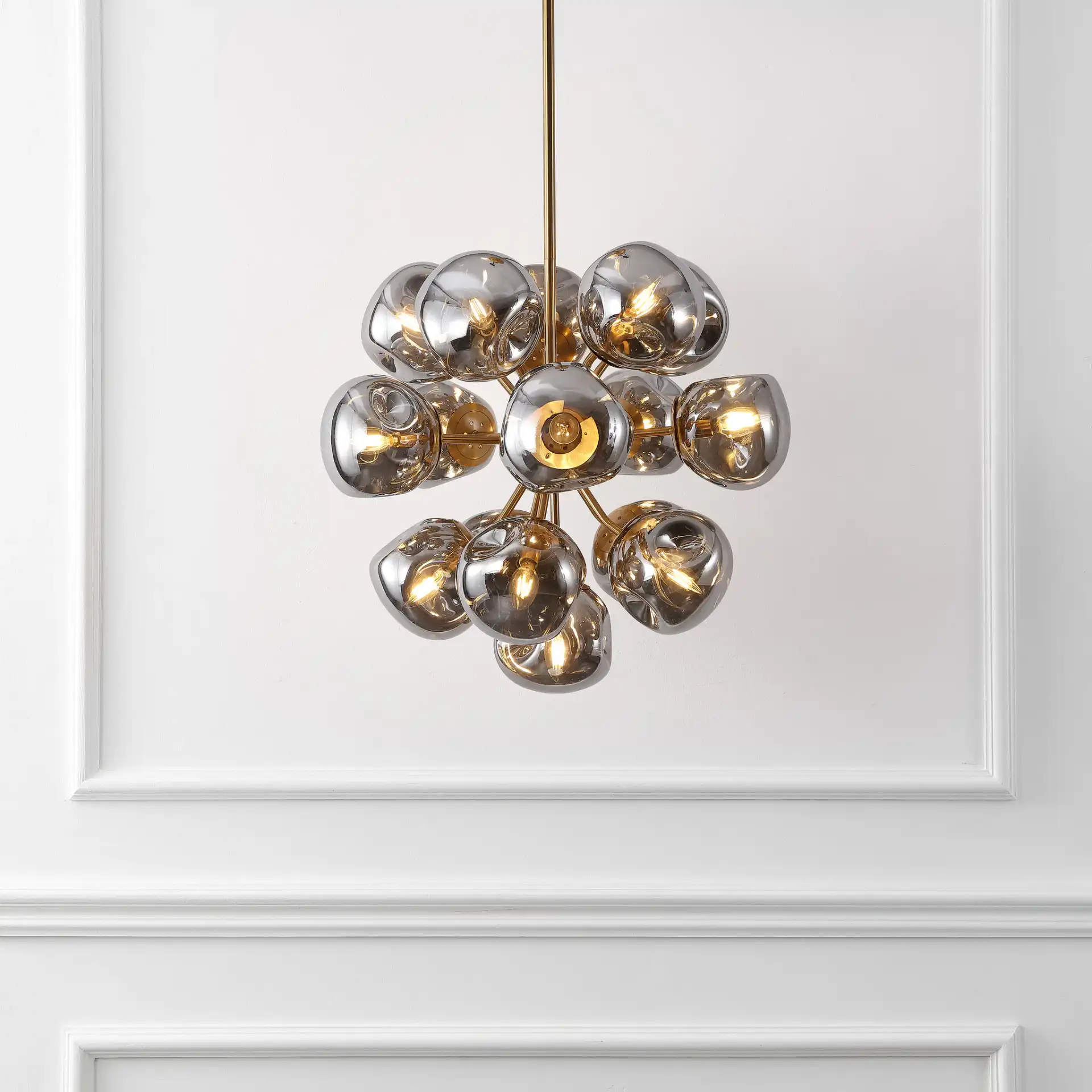 Paulia Chandelier in Chrome / Brass in a styled room