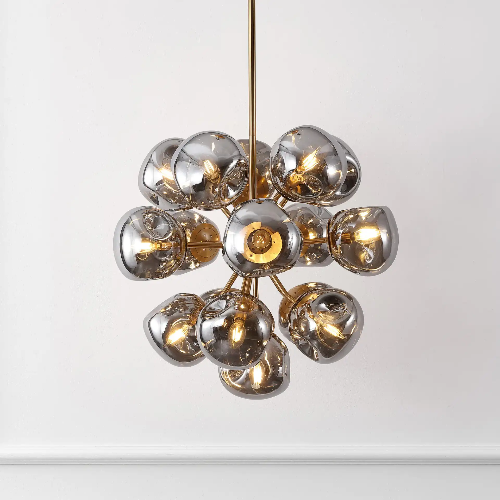 Paulia Chandelier in Chrome / Brass in a styled room